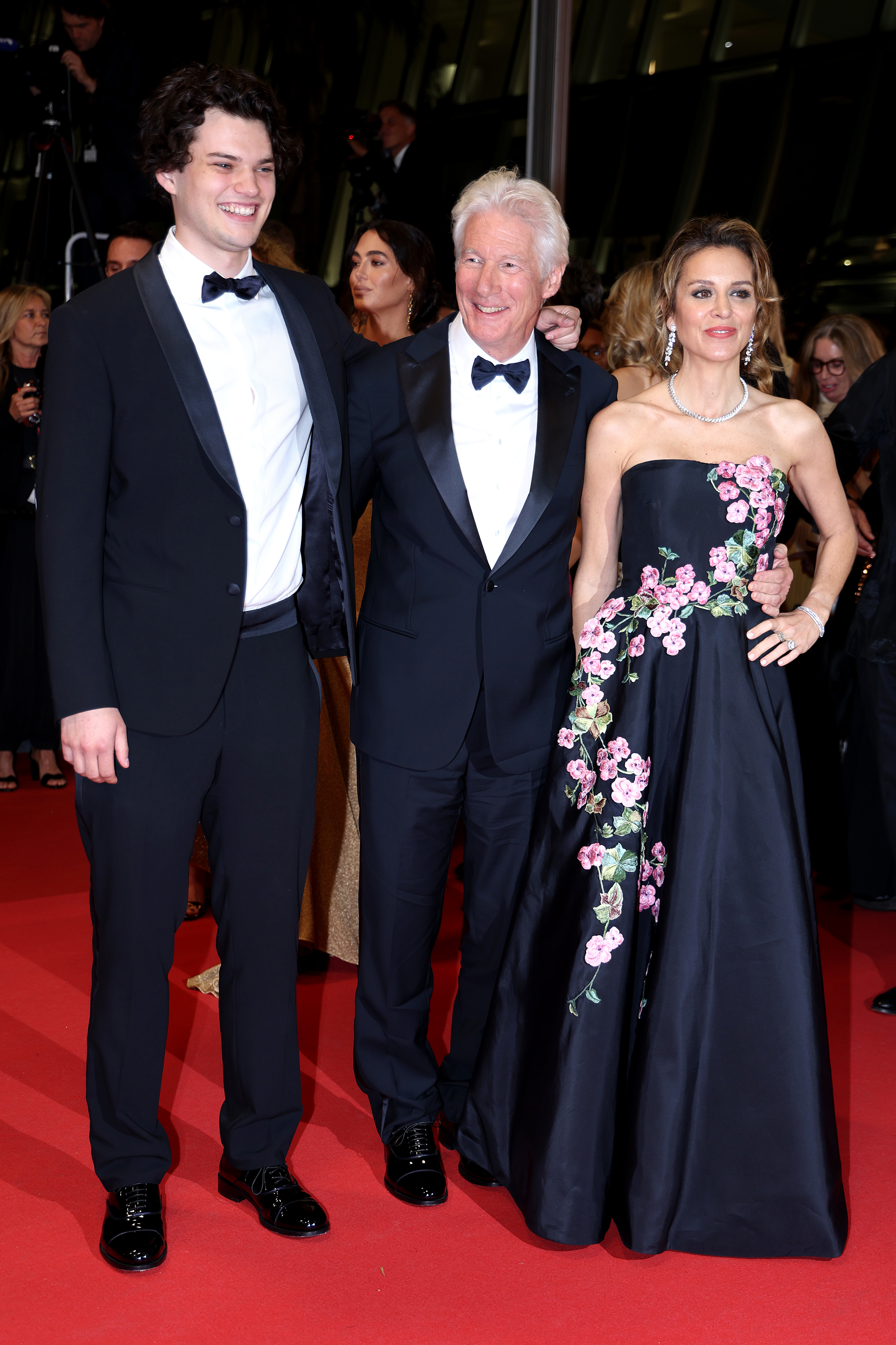 Homer James Jigme Gere, Richard Gere, and Alejandra Silva on the "Oh, Canada" red carpet during the 77th annual Cannes Film Festival in Cannes, France on May 17, 2024. | Source: Getty Images