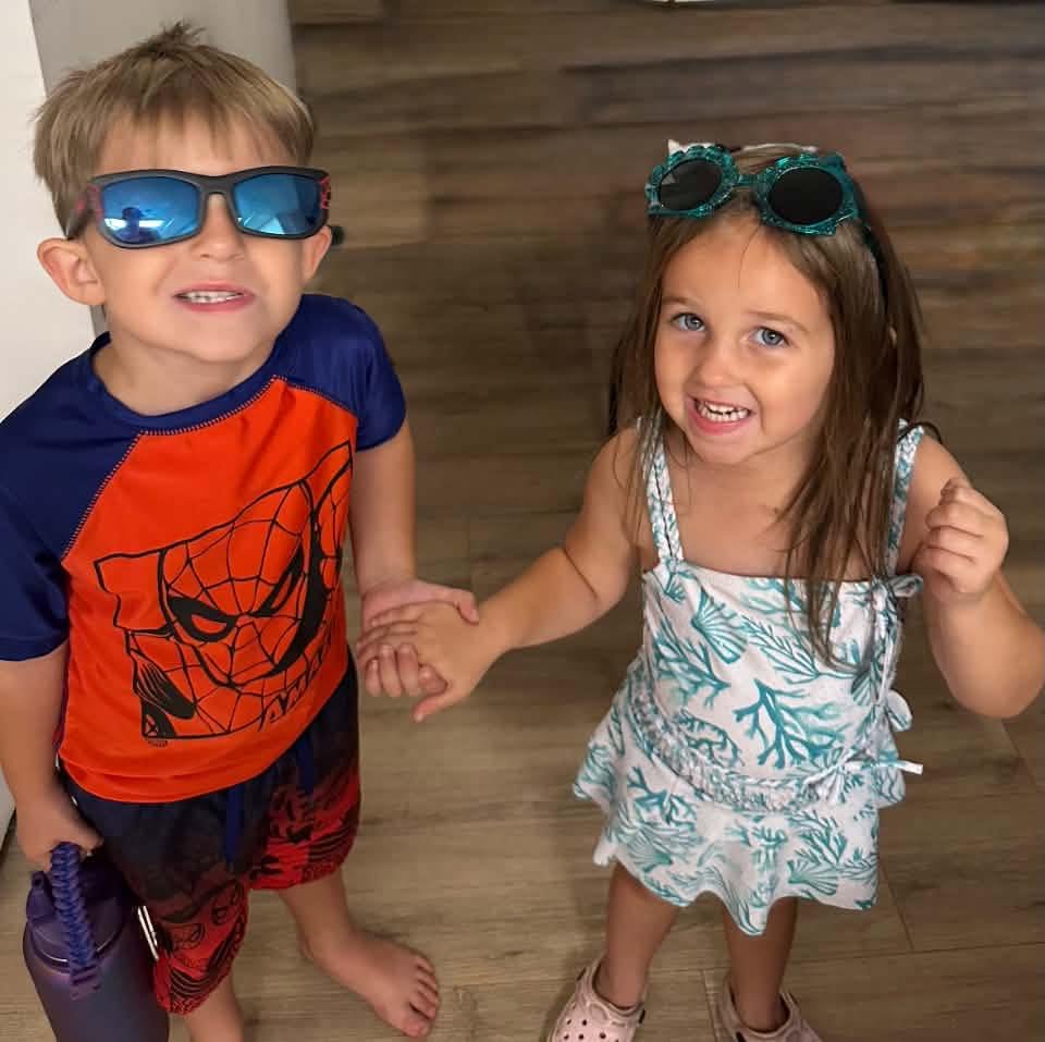 Brock and Briella Holmes looking ready for a beach or pool day, posted on July 25, 2026. | Source: Facebook/Suzi Holmes