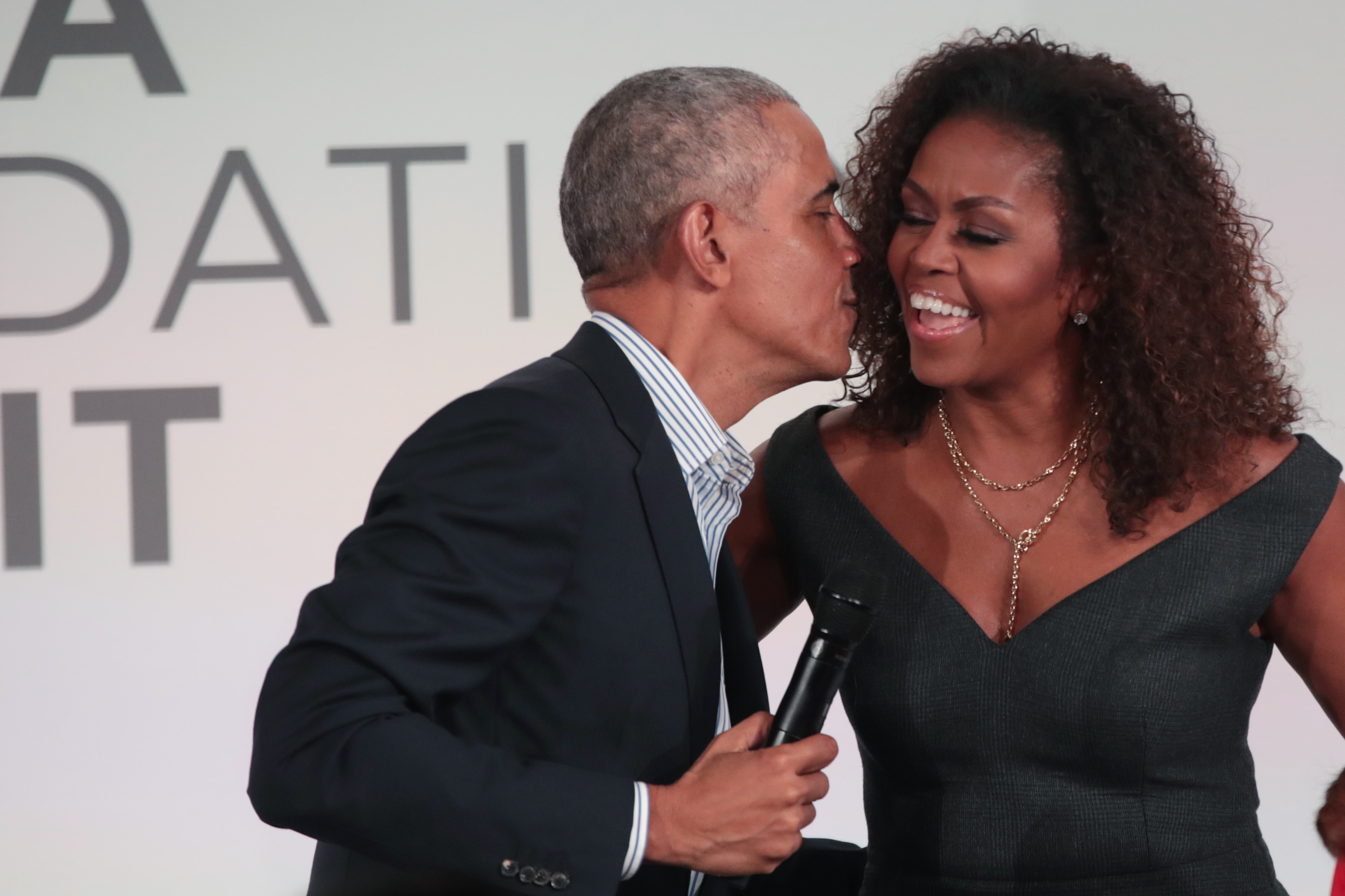 Former U.S. President Barack Obama giving Michelle Obama a kiss as they close the Obama Foundation Summit on the campus of the Illinois Institute of Technology on October 29, 2019, in Chicago. | Source: Getty Images
