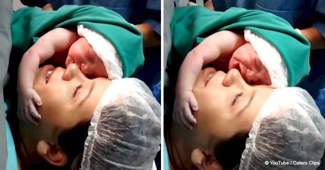 Heartwarming moment of a newborn baby clinging to mother right after birth (video)