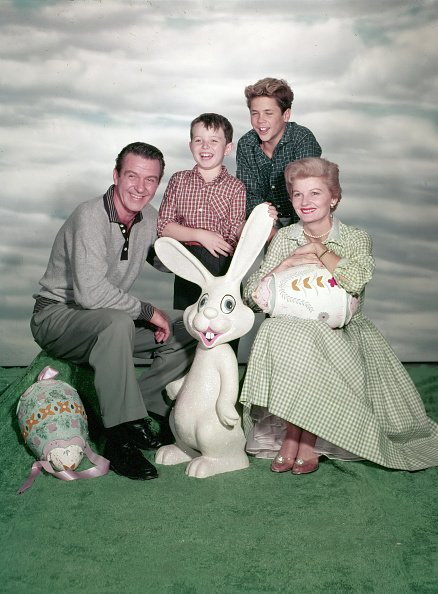 Hugh Beaumont, Jerry Mathers, Tony Dow, and Barbara Billingsley, posed for a publicity photo of "Leave It to Beaver" in an Easter setting, circa 1957. | Photo: Getty Images