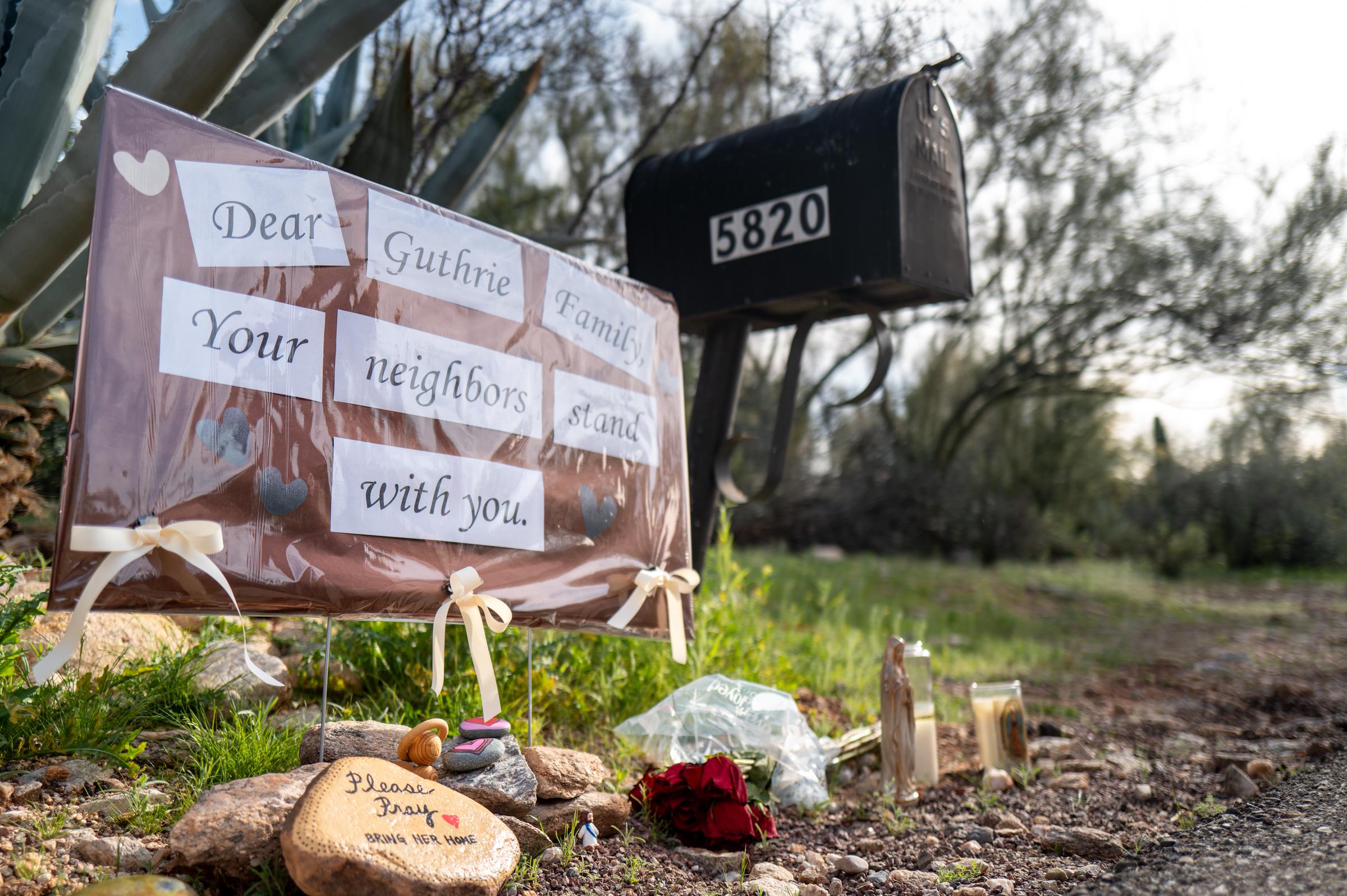 A makeshift memorial is stationed at the entrance to Nancy Guthrie's residence in Tucson, Arizona on February 10, 2026. | Source: Getty Images