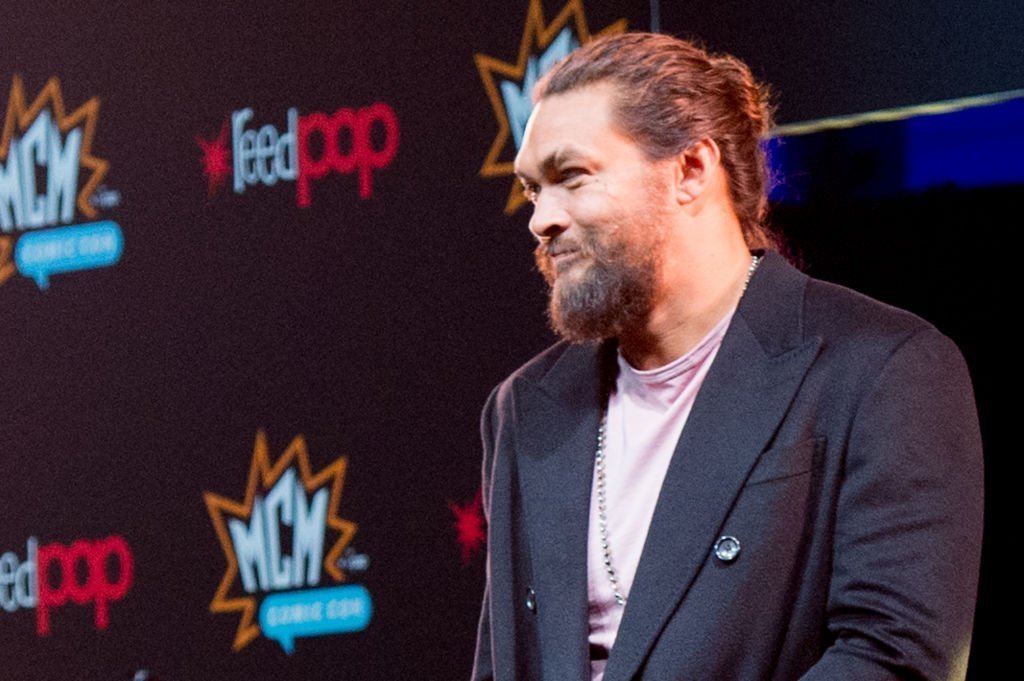 Jason Momoa smiles during a panel at the world premier of 'See' during day 1 of the October MCM London Comic Con 2019 at ExCel | Photo: Getty Images