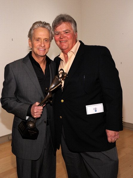 Michael Douglas (L) and producer Joel Douglas attend the Icon Award Presentation during the 22nd Annual Palm Springs International Film Festival at the Annenberg Theatre on January 13, 2011, in Palm Springs, California. | Source: Getty Images.