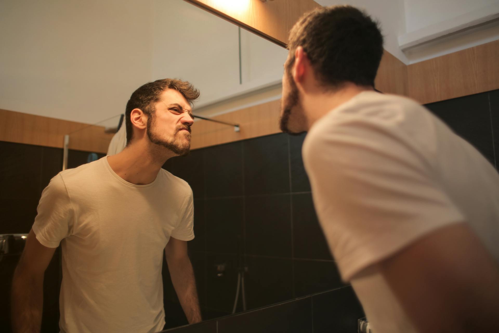 A man looking in the mirror | Source: Pexels