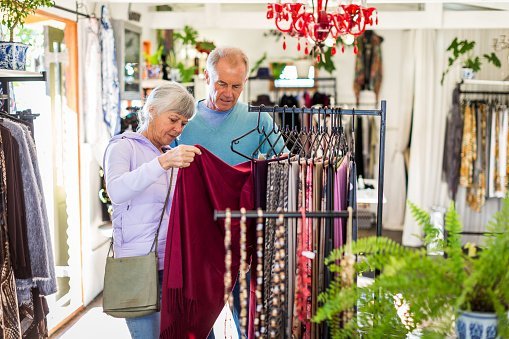 Photo of a senior couple shopping in a clothes store | Photo: Getty Images
