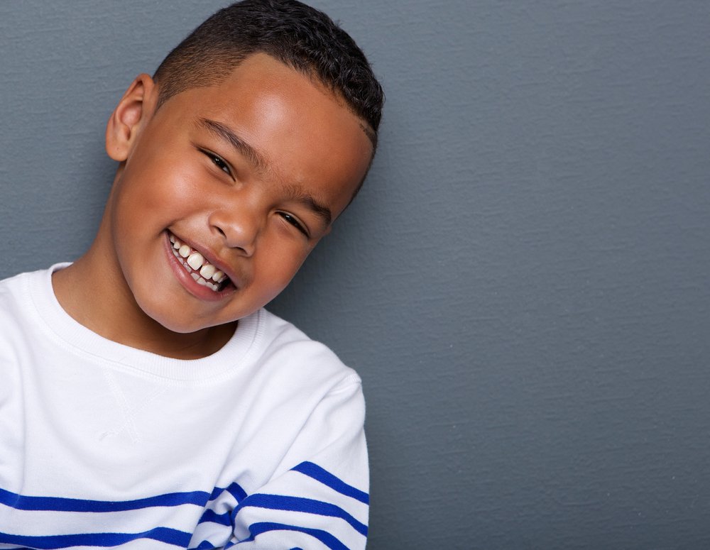 Un garçon souriant. Photo : Shutterstock Un garçon souriant. Photo : Shutterstock