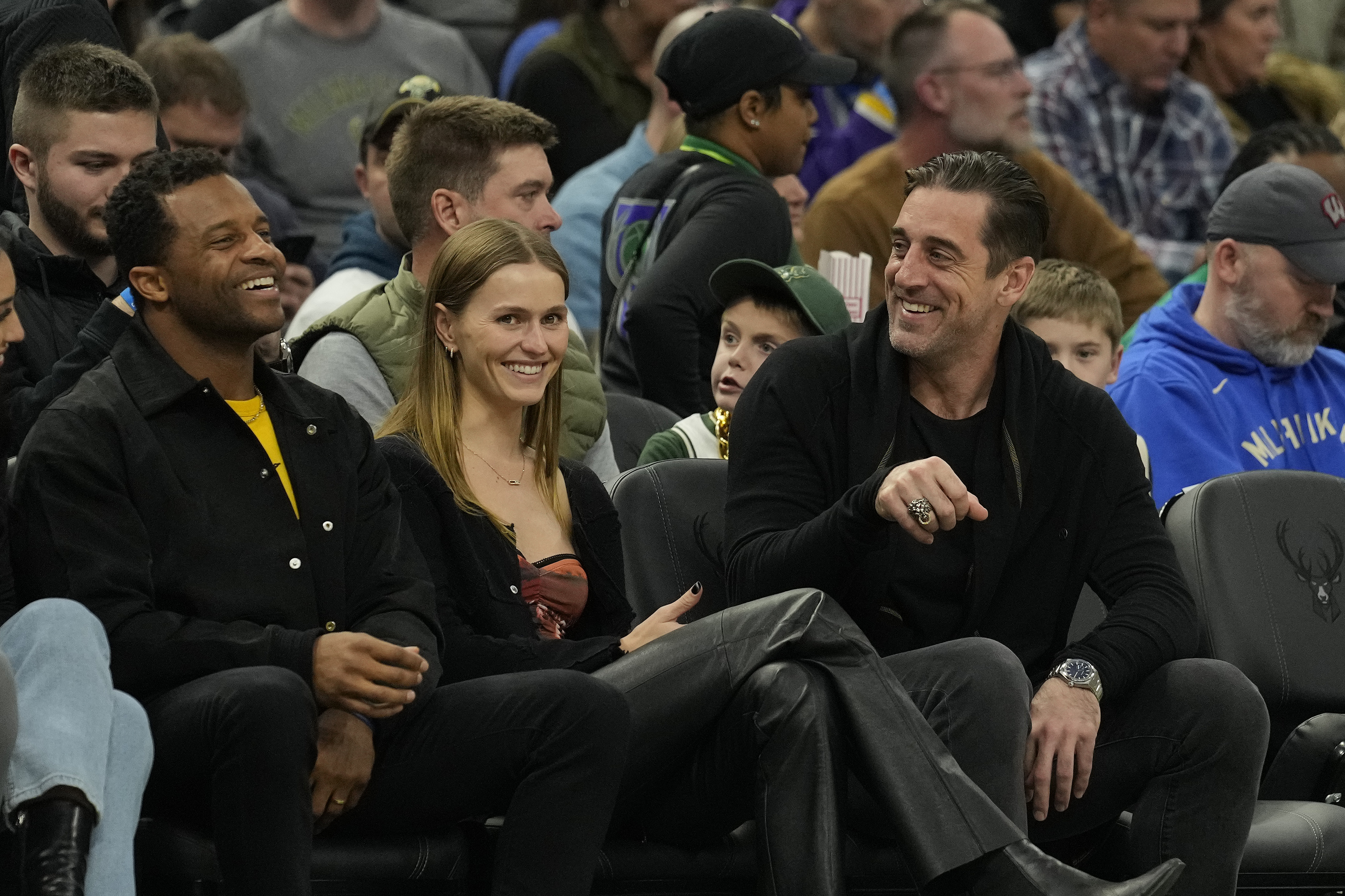 Randall Cobb, Mallory Edens, and Aaron Rodgers during a basketball game on December 2, 2022, in Milwaukee, Wisconsin. | Source: Getty Images