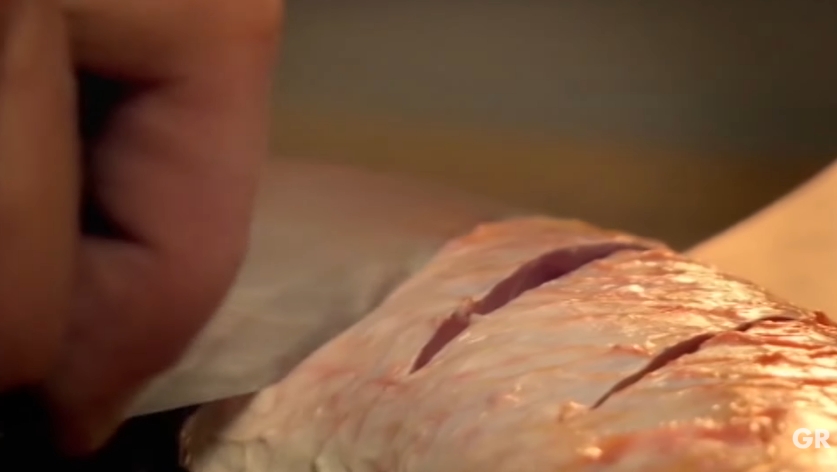 Gordon Ramsay demonstrates how making a few shallow cuts across the surface of meat before cooking can improve the final result. Scoring allows heat to penetrate more quickly while also helping marinades soak deeper into the meat for more even flavor. | Source: YouTube/ Gordon Ramsay