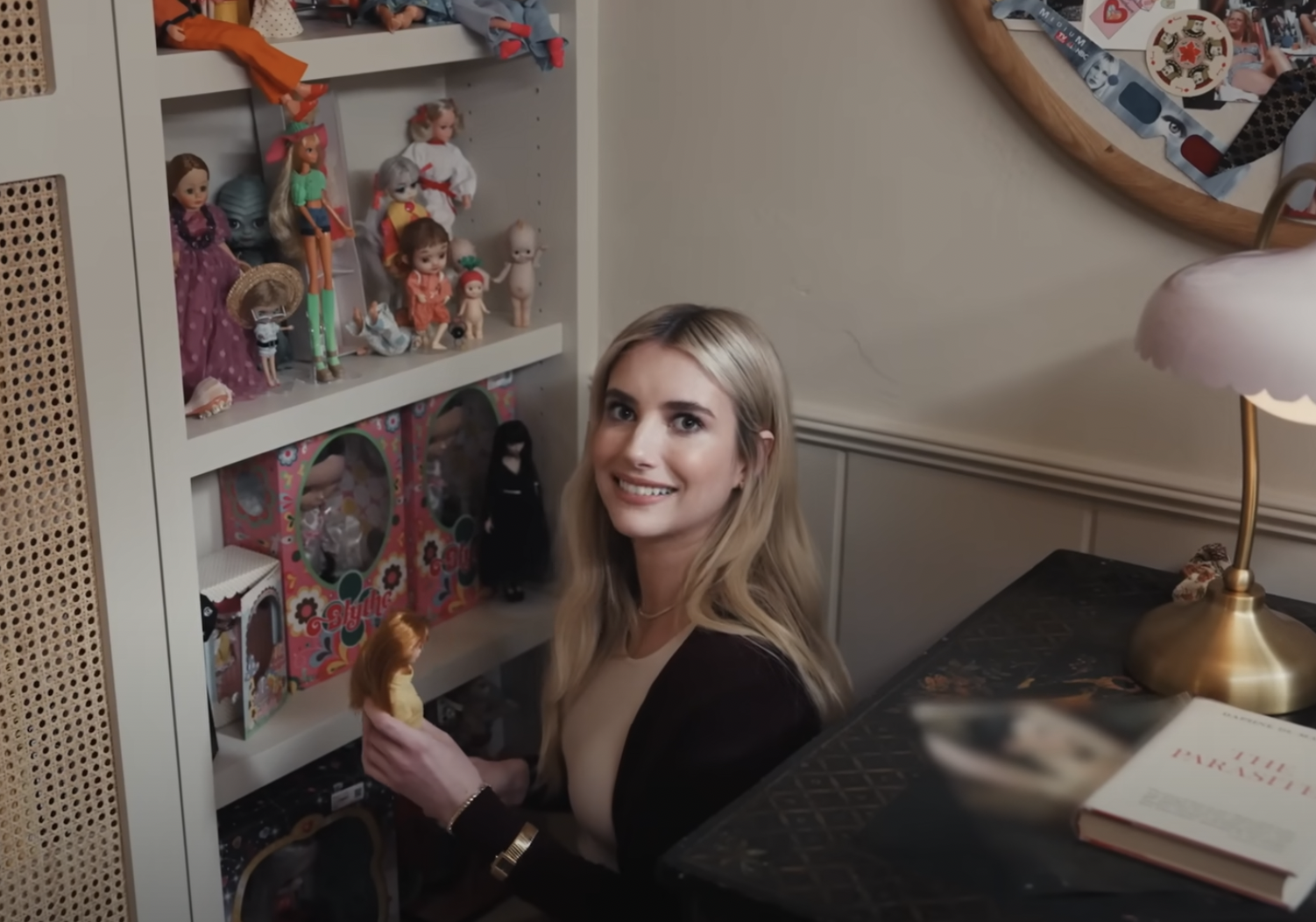 Emma Roberts and her doll wall featured in Architectural Digest, dated April 2024 | Source: YouTube/Architectural Digest