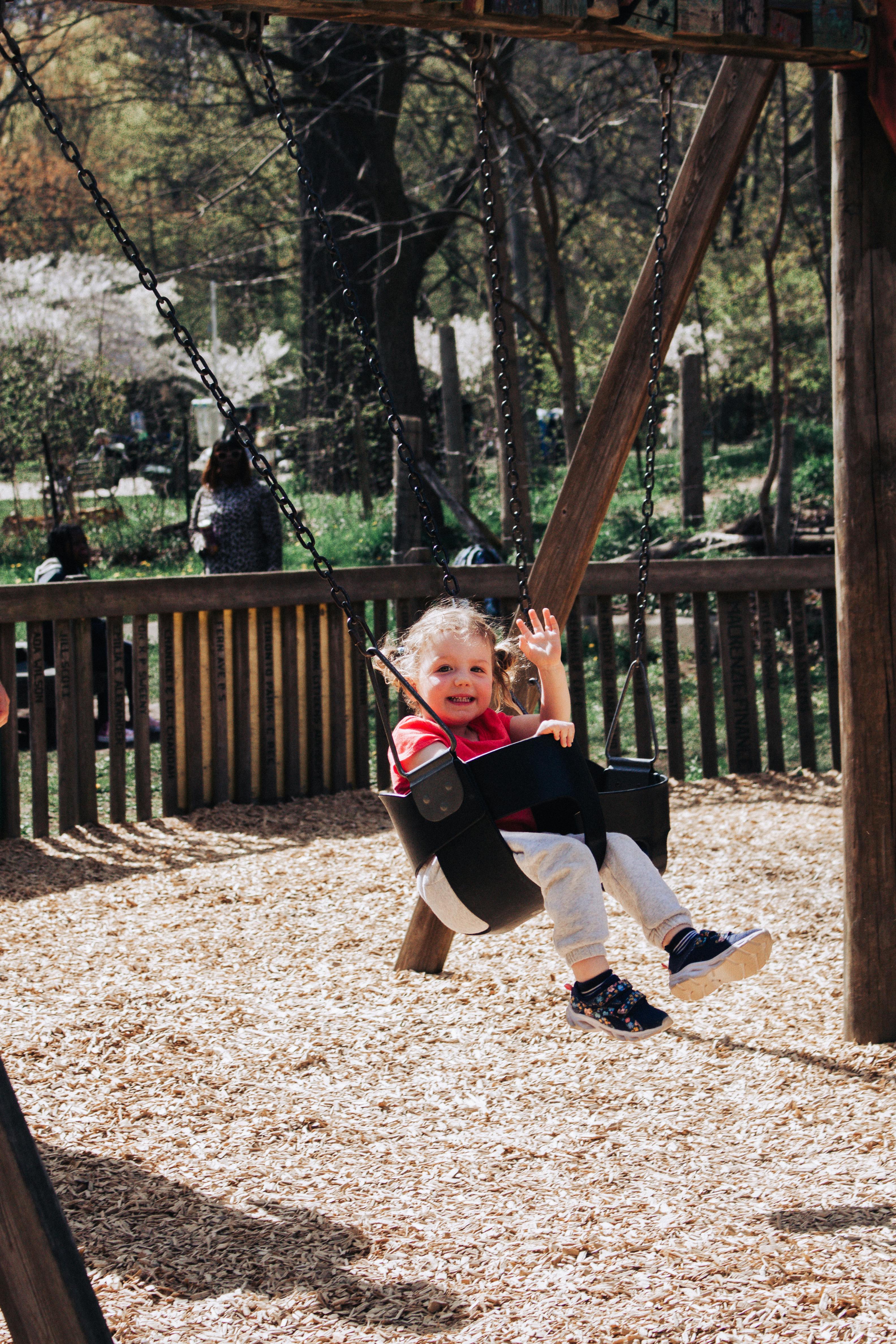 A happy girl on a swing | Source: Pexels