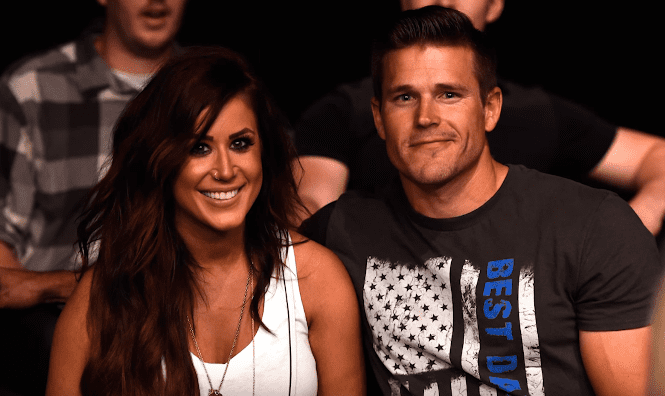 Chelsea Houska and her husband Cole DeBoer watch the fights during the UFC Fight Night event on July 13, 2016 at Denny Sanford Premier Center in Sioux Falls, South Dakota. | Photo: YouTube/US Weekly