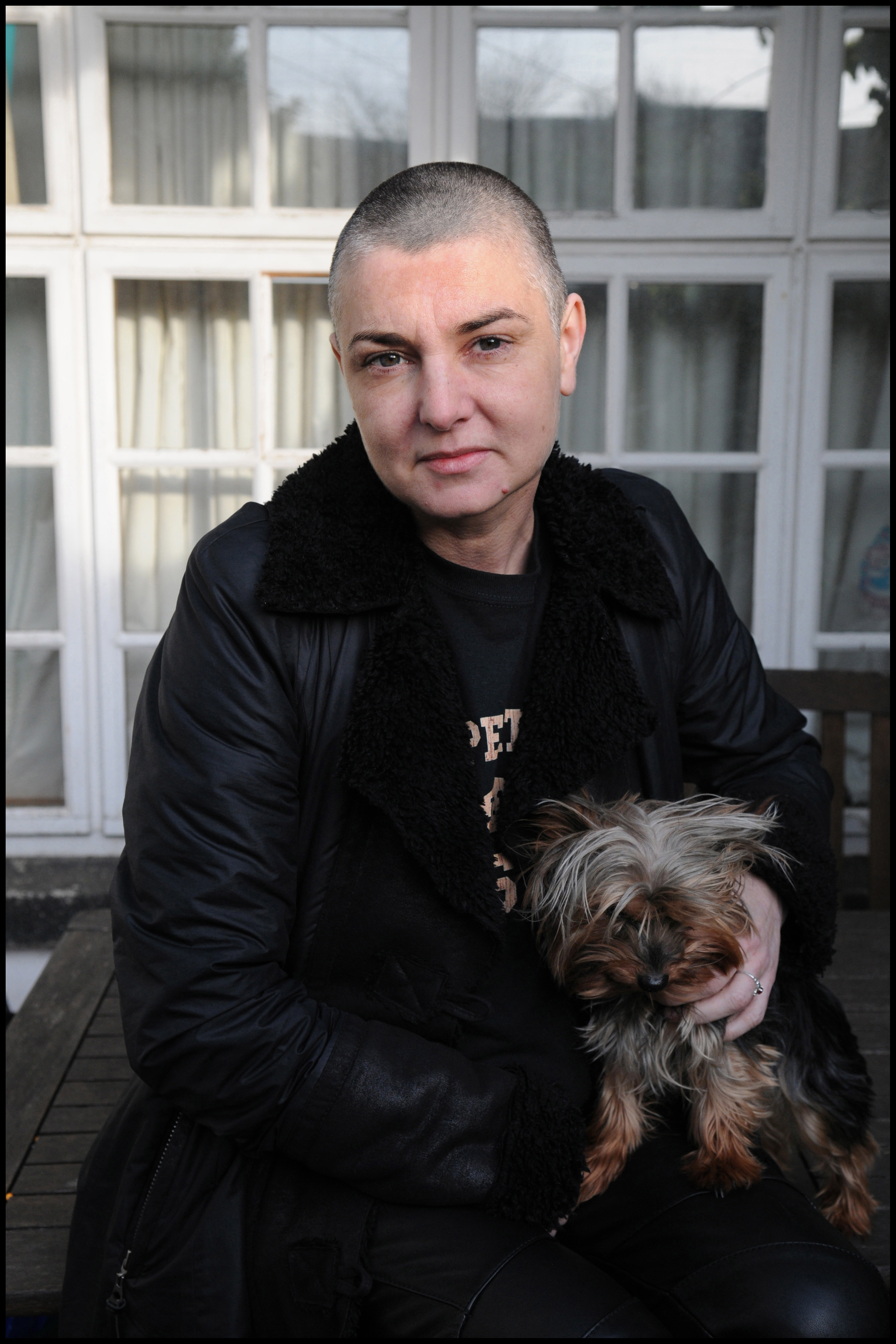 Sinéad O'Connor and her pet dog at her home in County Wicklow, Ireland, on February 3, 2012 | Source: Getty Images