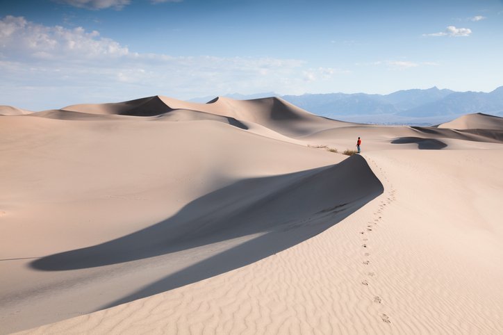 Tourist at Mesquite Sand Dunes, Death valley, USA | Photo: Getty Images