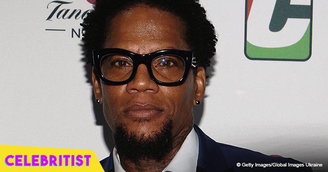 D.L. Hughley shares picture holding his dad's hand on hospital bed