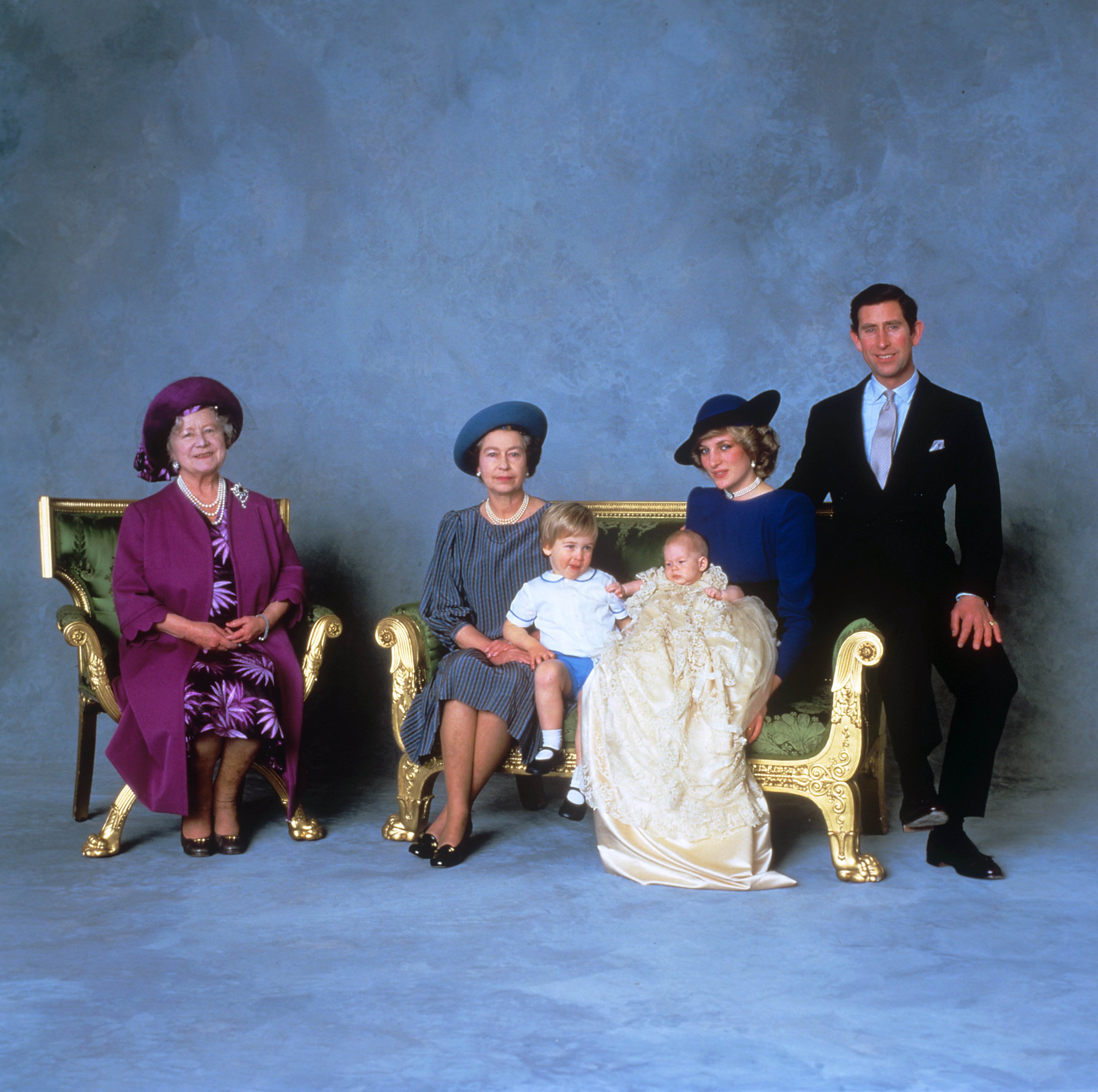Prince Harry, Prince of Wales with his mother, father, elder brother Prince William, the Queen and the Queen Mother pose for a portrait at his christening. Windsor, England. December 21, 1984 | Source: Getty Images
