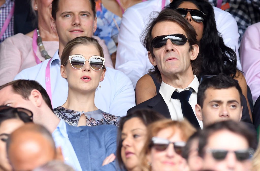 Rosamund Pike and Robie Uniacke at Wimbledon 2017 as evian guests during day 13 on July 16, 2017 in London, England | Photo: Getty Images