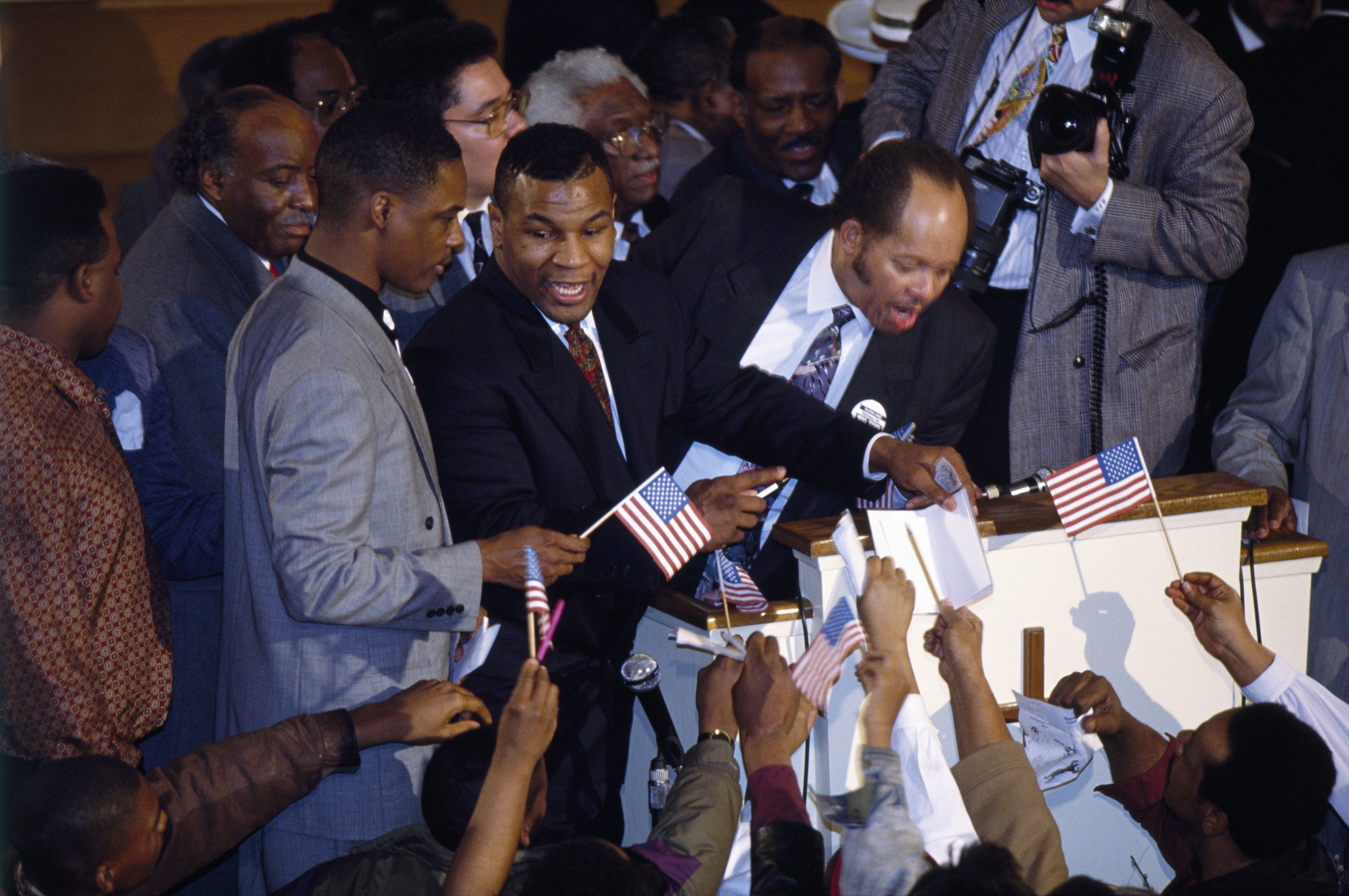 Mike Tyson attending a church service held in support of the boxer as he stood trial for the rape Desiree Washington | Source: Getty Images