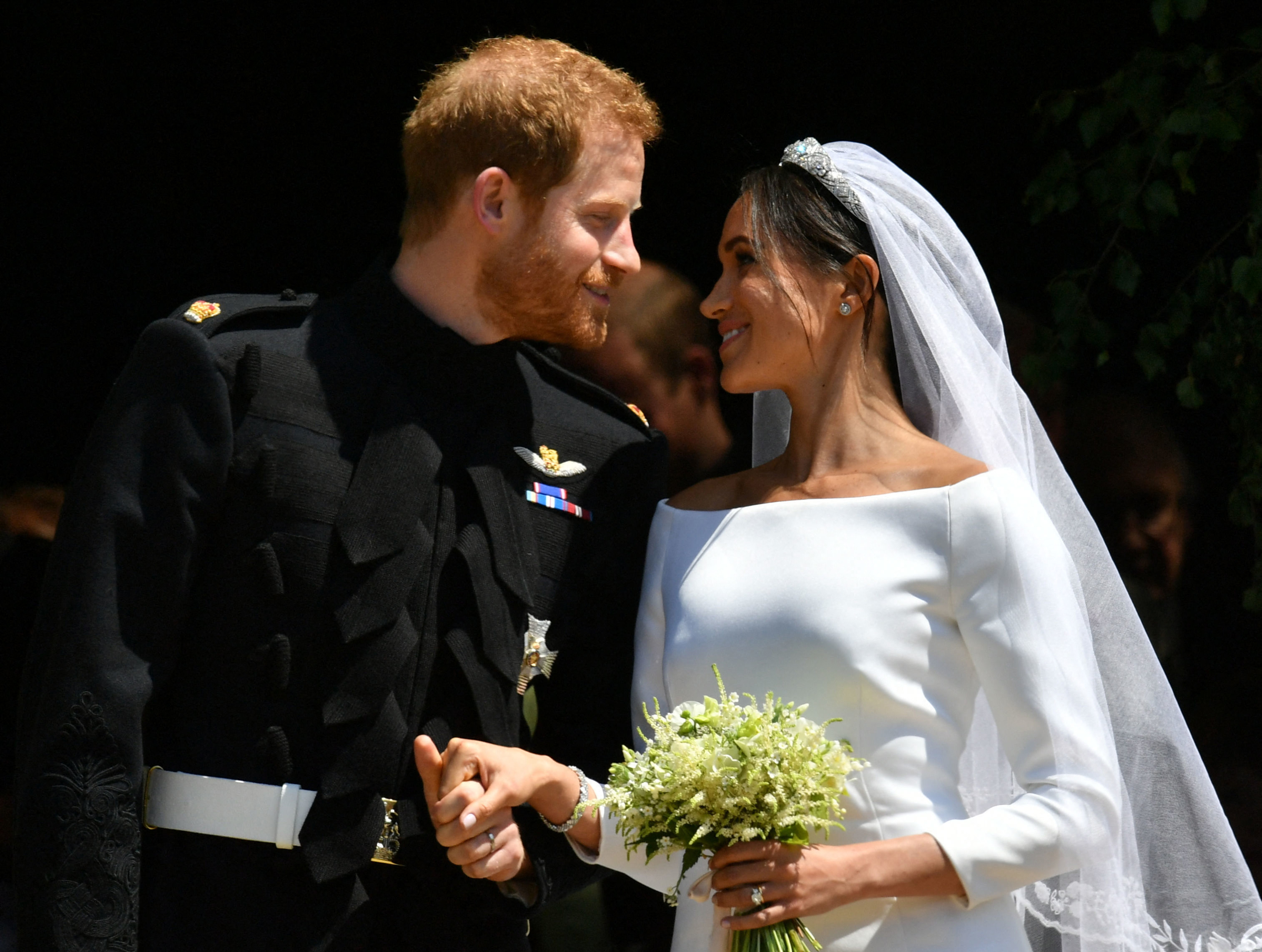Prince Harry, Duke of Sussex and his wife Meghan, Duchess of Sussex emerge from the West Door of St George's Chapel, Windsor Castle, on May 19, 2018 after their wedding ceremony. | Source: Getty Images