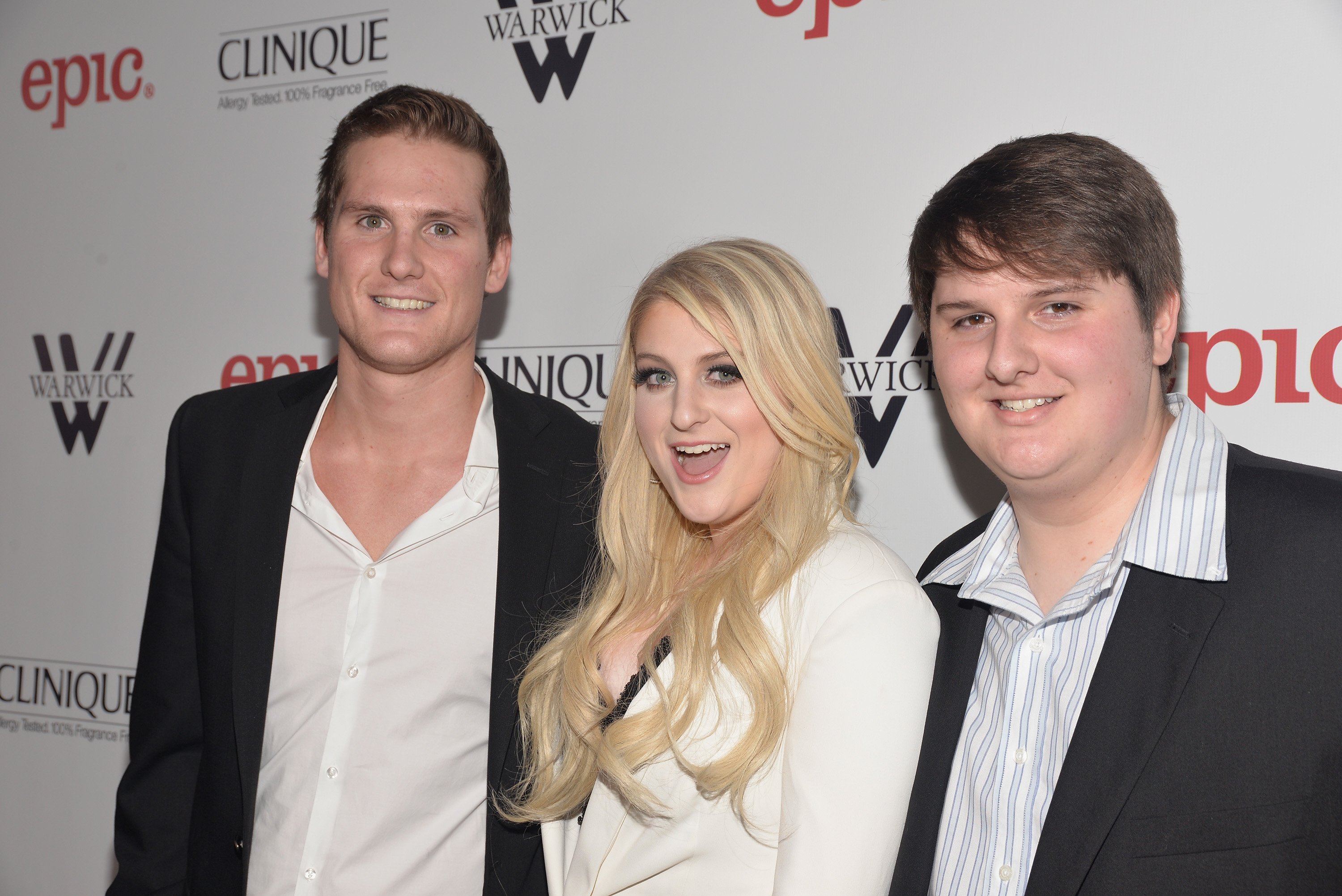 Singer/songwriter Meghan Trainor attends the release party for her debut album "Title" with brothers Ryan Trainor (L) and Justin Trainor (R) at Warwick on January 13, 2015, in Hollywood, California. | Source: Getty Images
