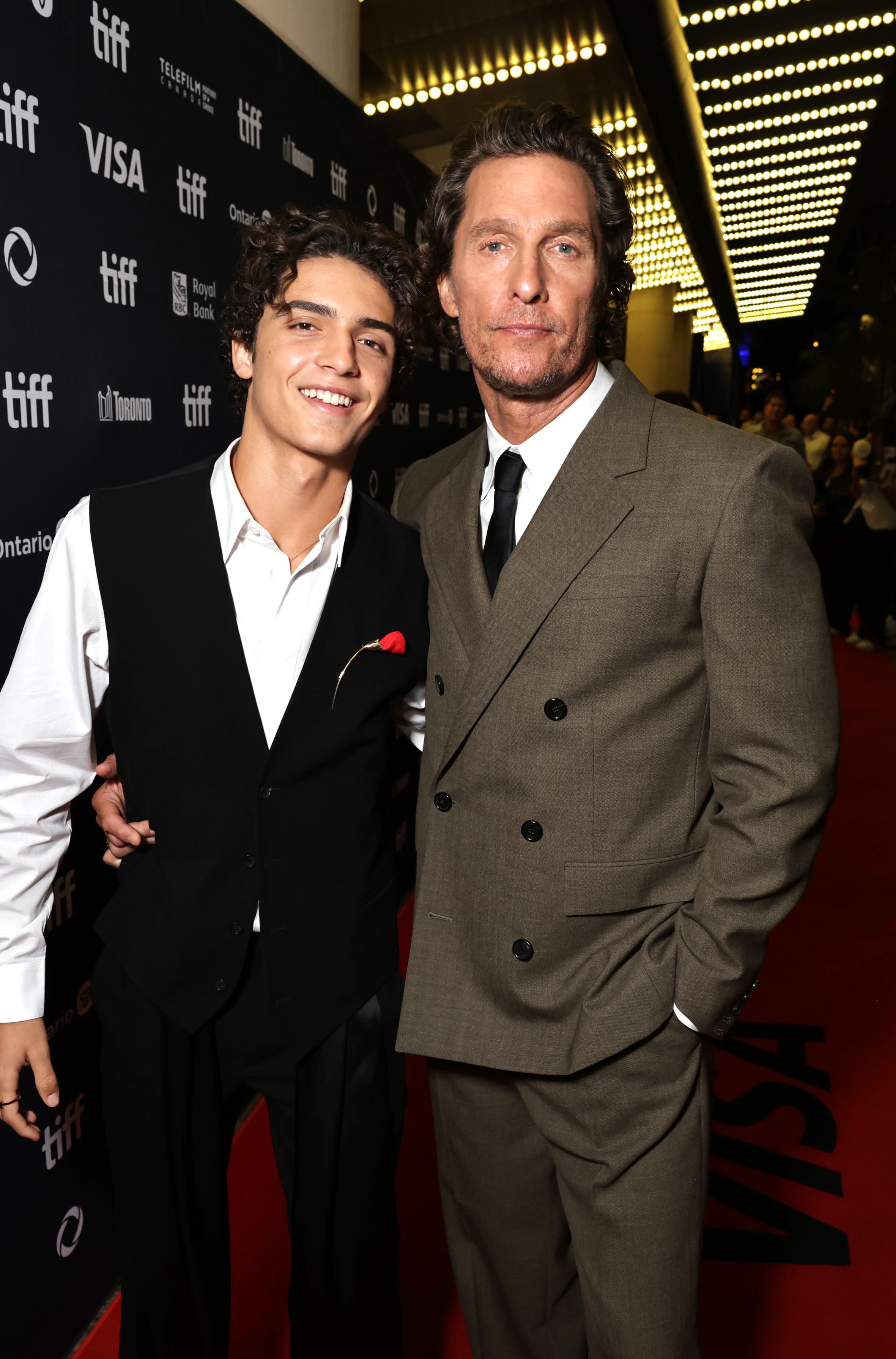 Father-son stars — Levi poses proudly beside Matthew McConaughey at the world premiere of The Lost Bus in Toronto on September 5, 2025.