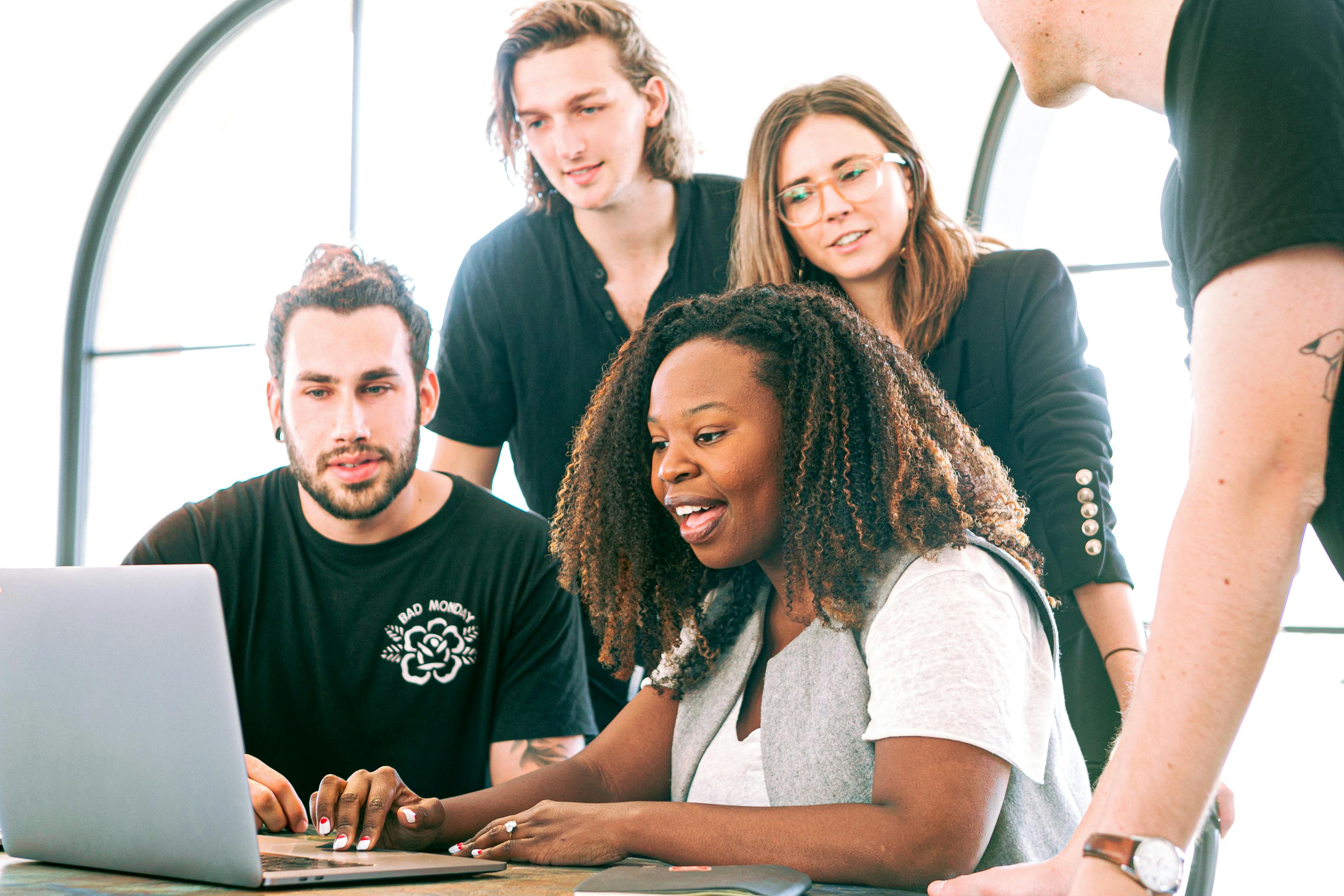 Colleagues engaged at a laptop | Source: Pexels