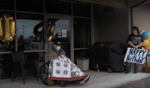 104-year-old coronavirus survivor William Lapschies spend time with his family at a safe distance in celebration of his birthday on April 1, 2020. | Source: YouTube/ The Oregonian.