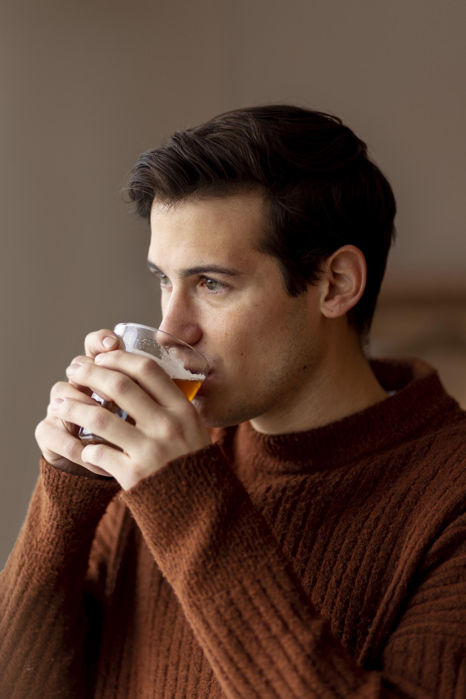 A young man drinking his tea | Source: Freepik