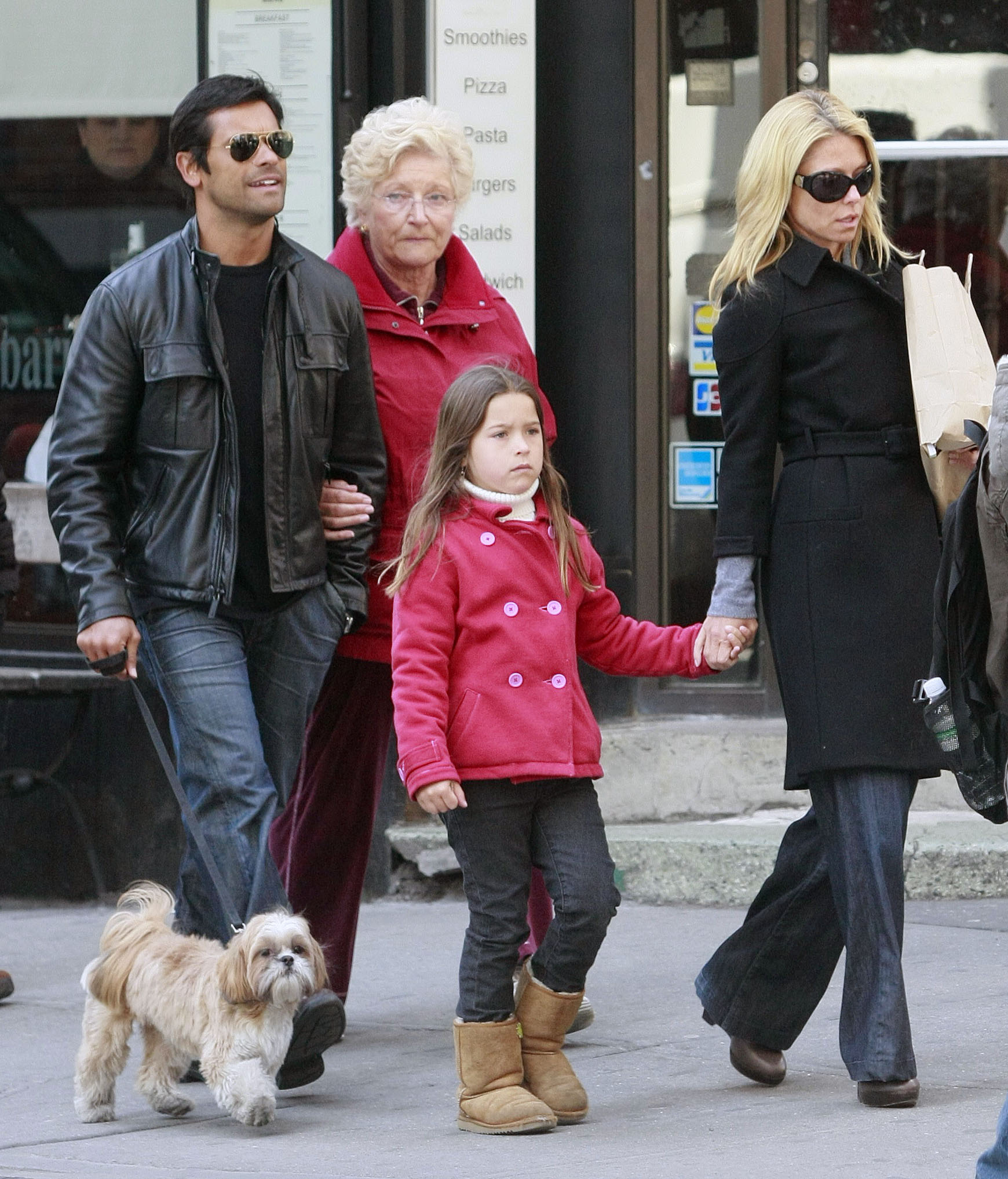 Kelly Ripa and Mark Consuelos seen walking in SOHO with their daughter Lola on March 30, 2008 | Source: Getty Images