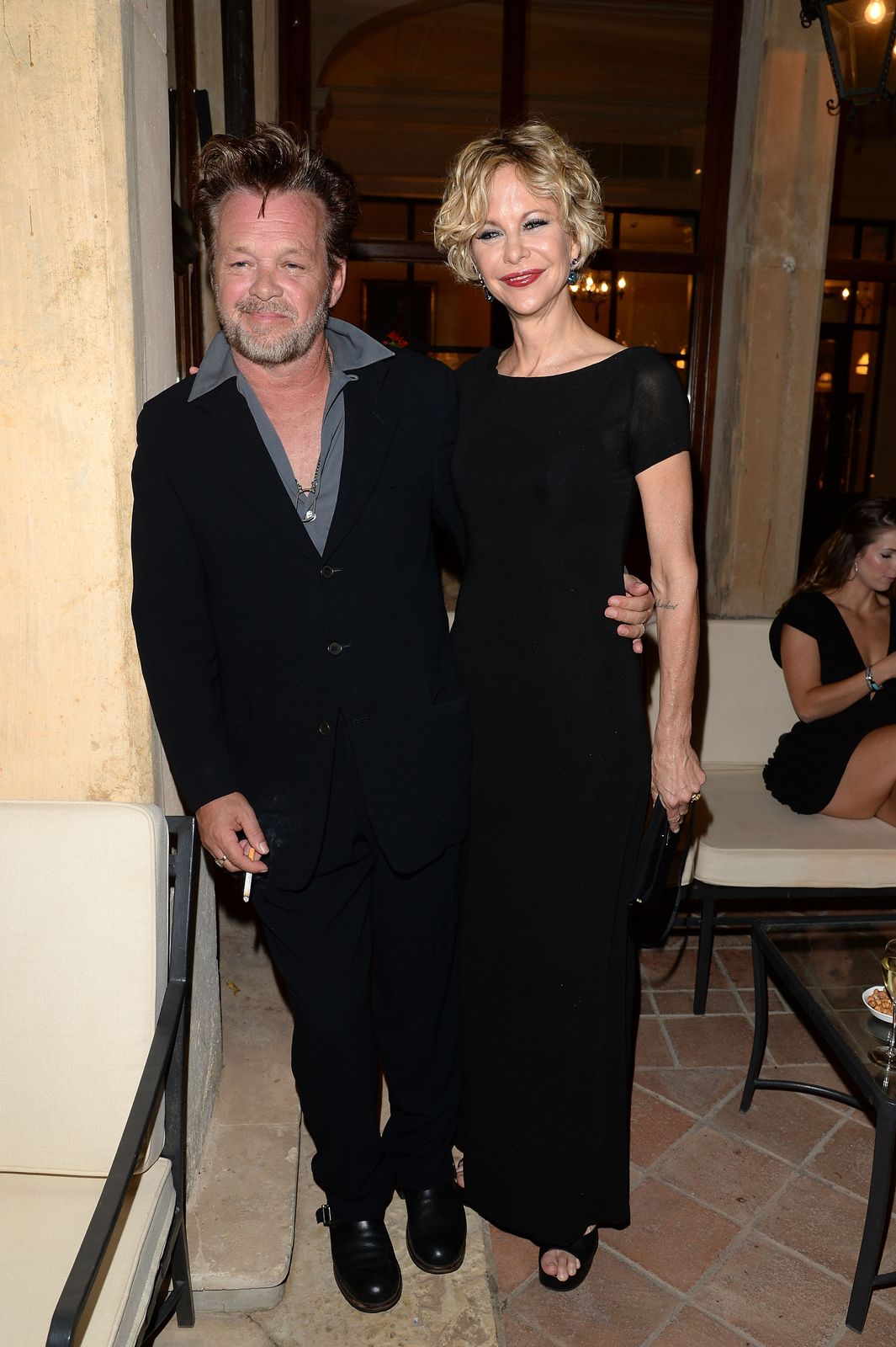John Mellencamp and Meg Ryan at the Taormina Filmfest held at the Teatro Antico on June 20, 2013, in Italy | Photo: Venturelli/Getty Images