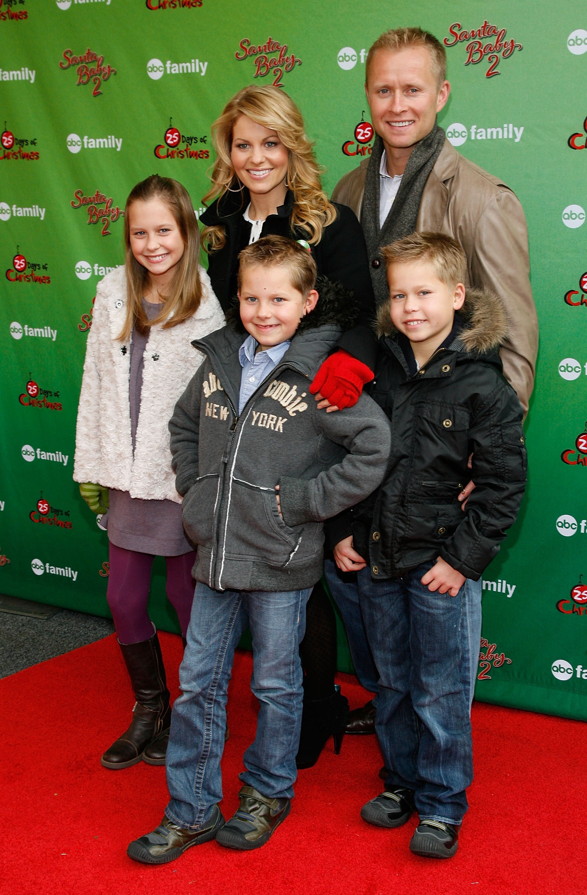 Actress Candace Cameron Bure and her husband Valeri Bure and children Natasha, Lev and Maksim attend the ABC Family's World Record Elf Party at Bryant Park on December 7, 2009 in New York City. | Source: Getty Images