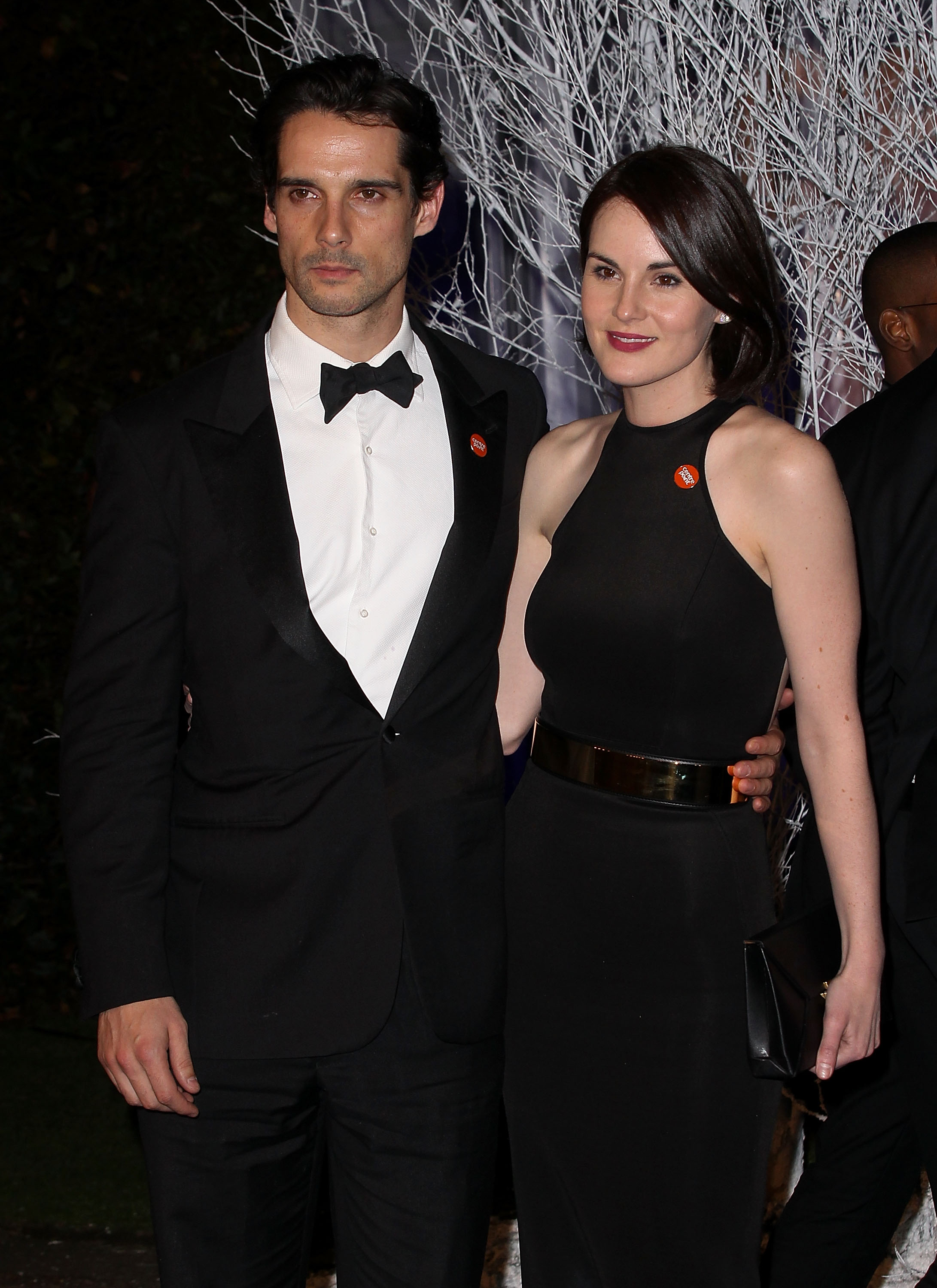 Michelle Dockery and John Dineen are pictured at the Winter Whites Gala in aid of Centrepoint at Kensington Palace on November 26, 2013, in London, England | Source: Getty Images