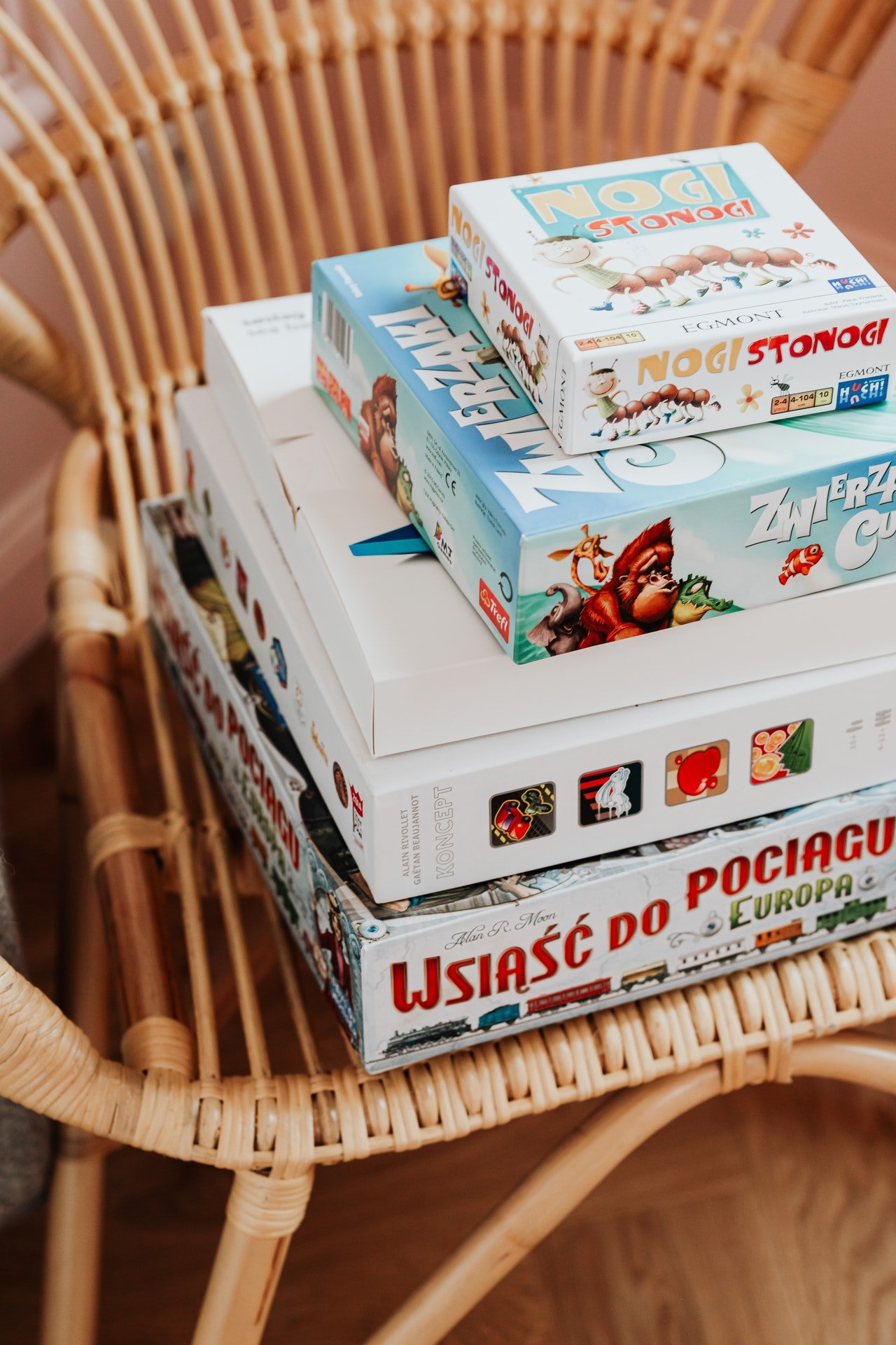 Bob gathered all the board games in his house. | Source: Pexels