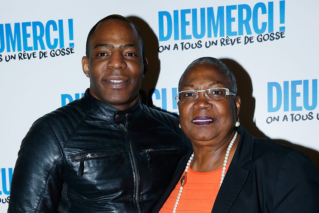 l'actrice Firmine Richard et son fils Keneff assister à la 'Dieu Merci!' Paris Première au Ministère de l'Outremer le 29 février 2016 à Paris, France. | Photo : Getty Images