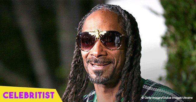 Snoop Dogg's wife is 'living her best life', showing off her assets in tiny top & black pants