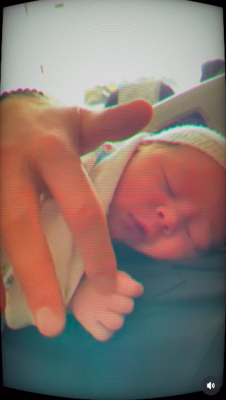 Prince Harry gently stroking one of his newborns' hand as the baby sleeps peacefully on his chest, posted on June 16, 2025. | Source: Instagram/meghan