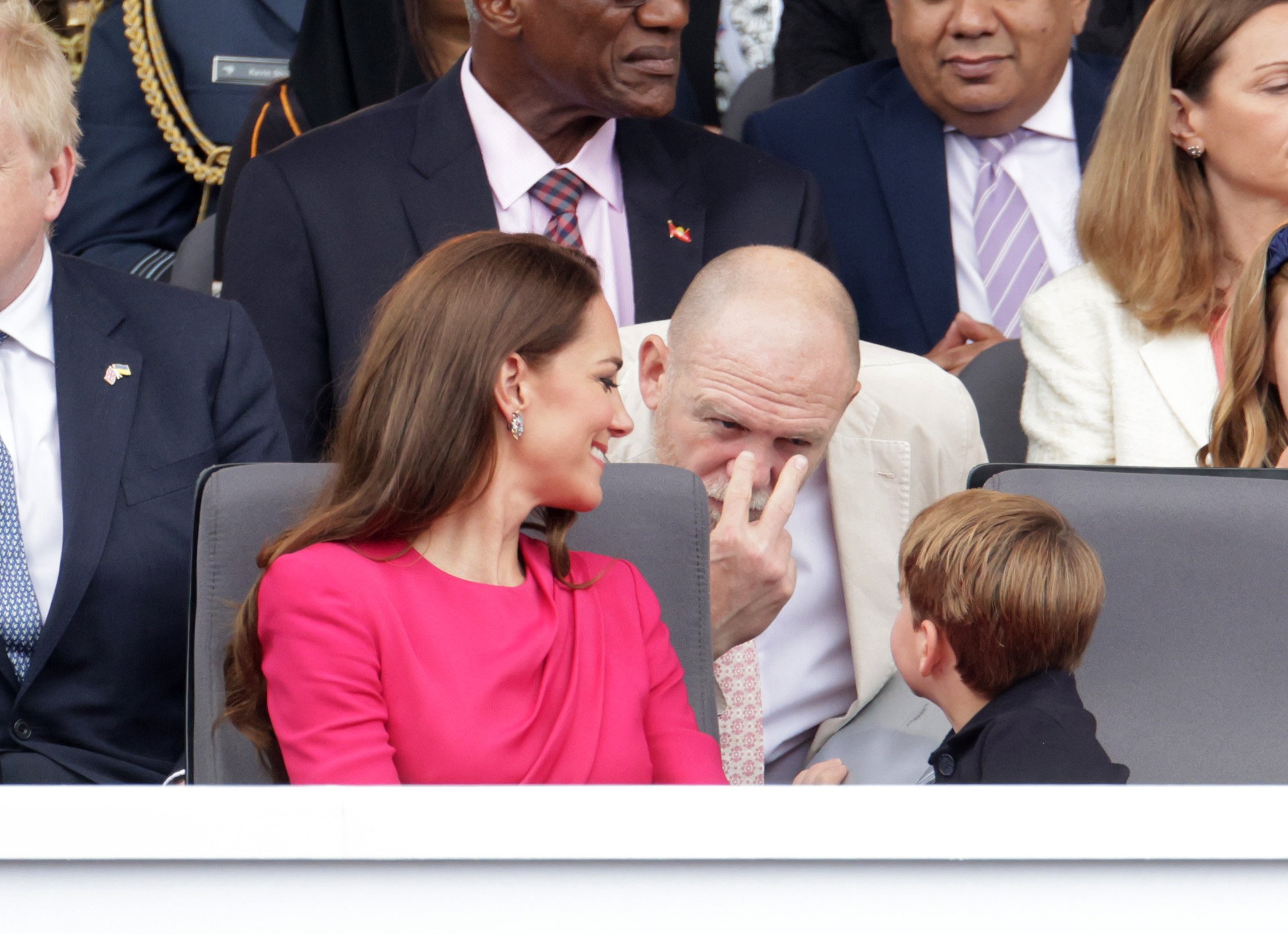 Catherine, Duchess of Cambridge, Mike Tindall and Prince Louis of Cambridge speak ahead the Platinum Pageant on June 05, 2022 in London, England. | Source: Getty Images