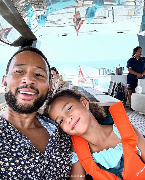 A screenshot of Chrissy Teigen's husband, John Legend and their daughter, Luna inside a yacht. | Source: Instagram/chrissyteigen