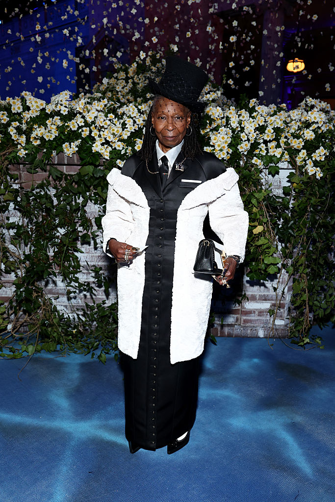 Whoopi Goldberg makes a grand entrance with her tuxedo-inspired look and top hat at the 2025 Met Gala celebrating "Superfine: Tailoring Black Style."
