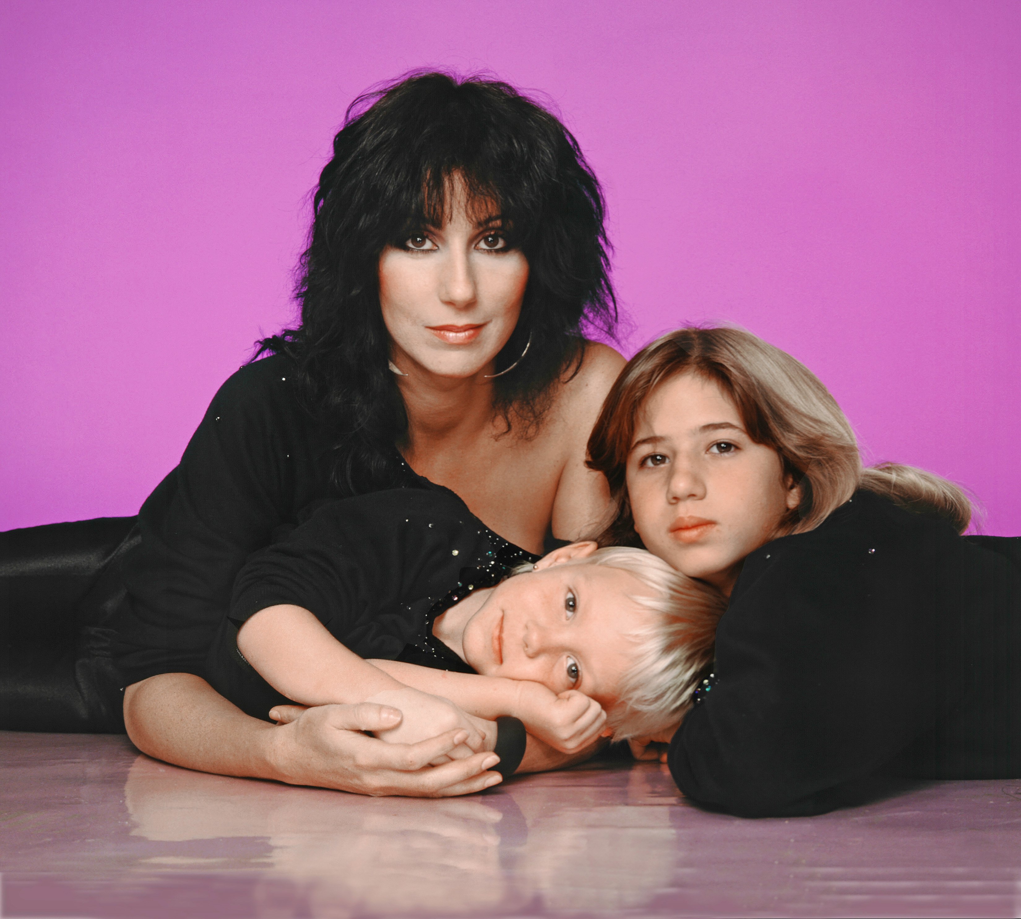 Cher with her children Chastity (Chaz) Bono and Elijah Blue Allman posing for a portrait in 1980 in Los Angeles, California | Source: Getty Images