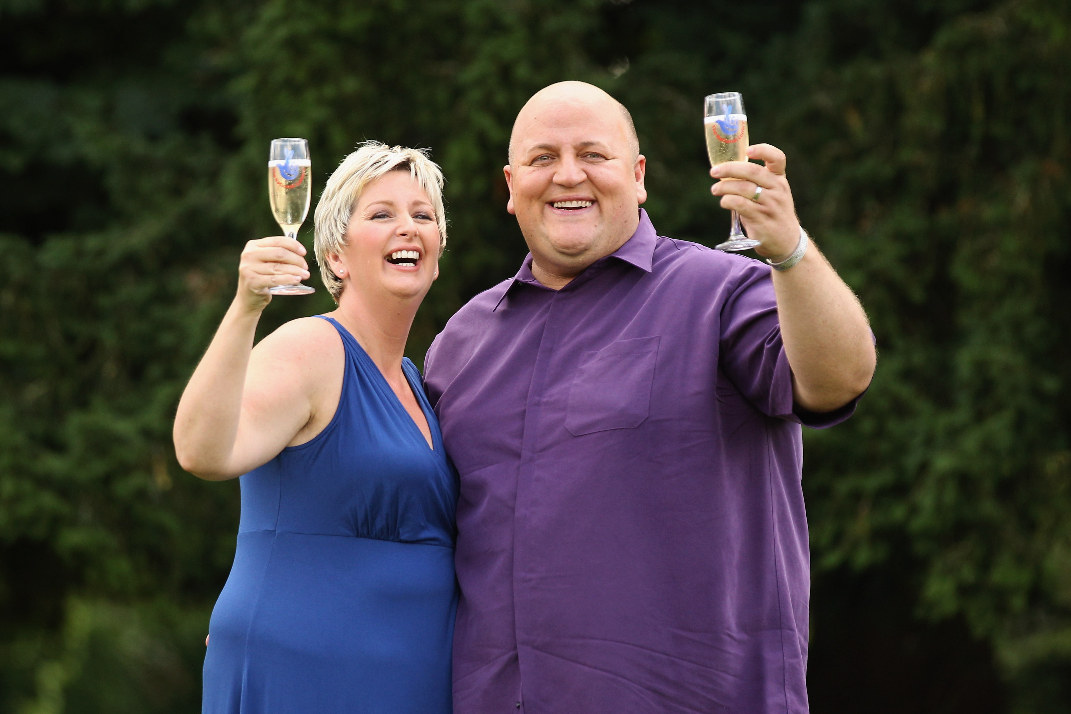 Gillian and Adrian Bayford celebrate winning the jackpot of over 148 million GBP in the EuroMillions lottery on August 14, 2012, in Hatfield Heath, England | Source: Getty Images