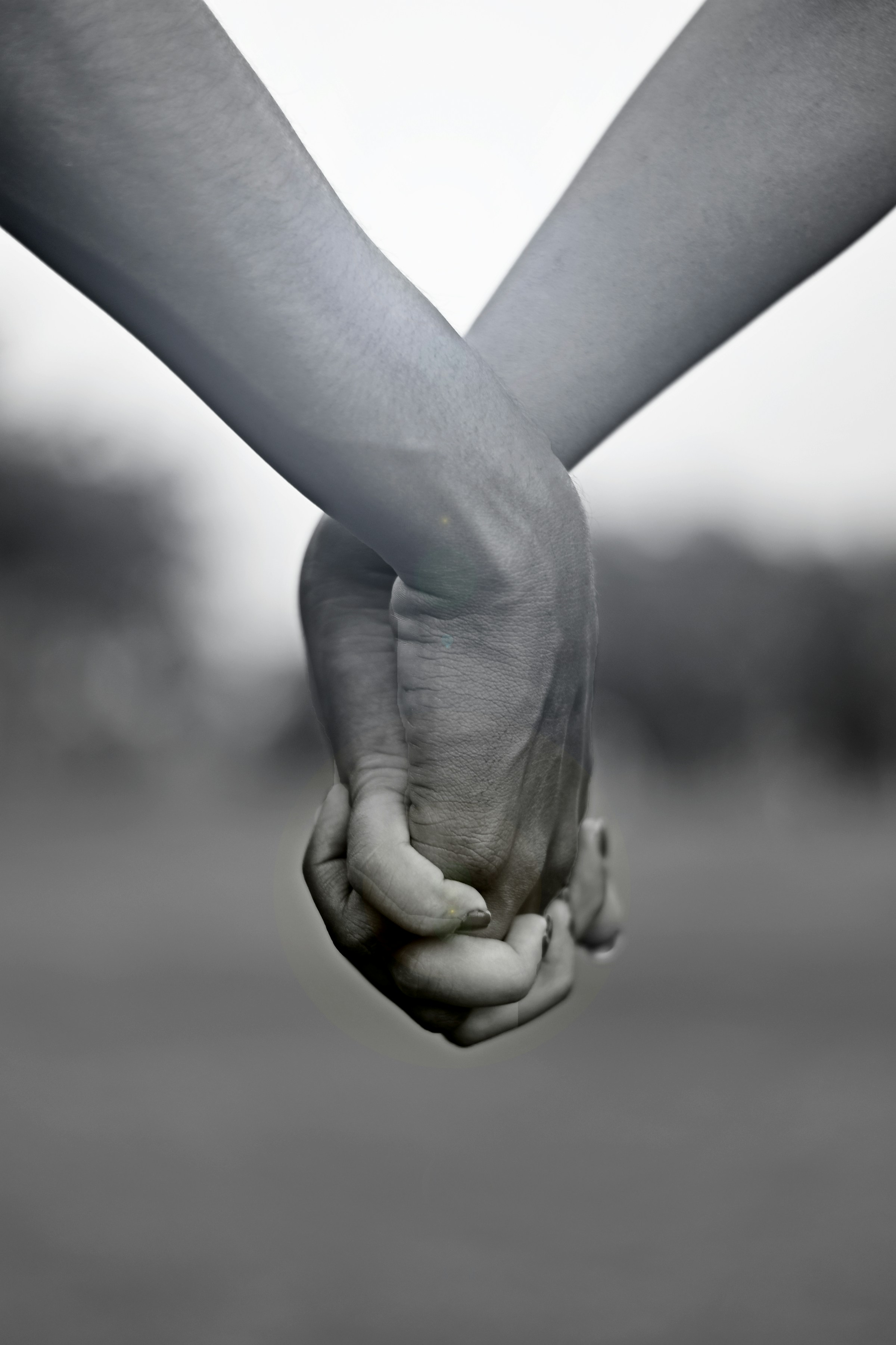 Close-up of a couple with their hands intertwined | Source: Unsplash