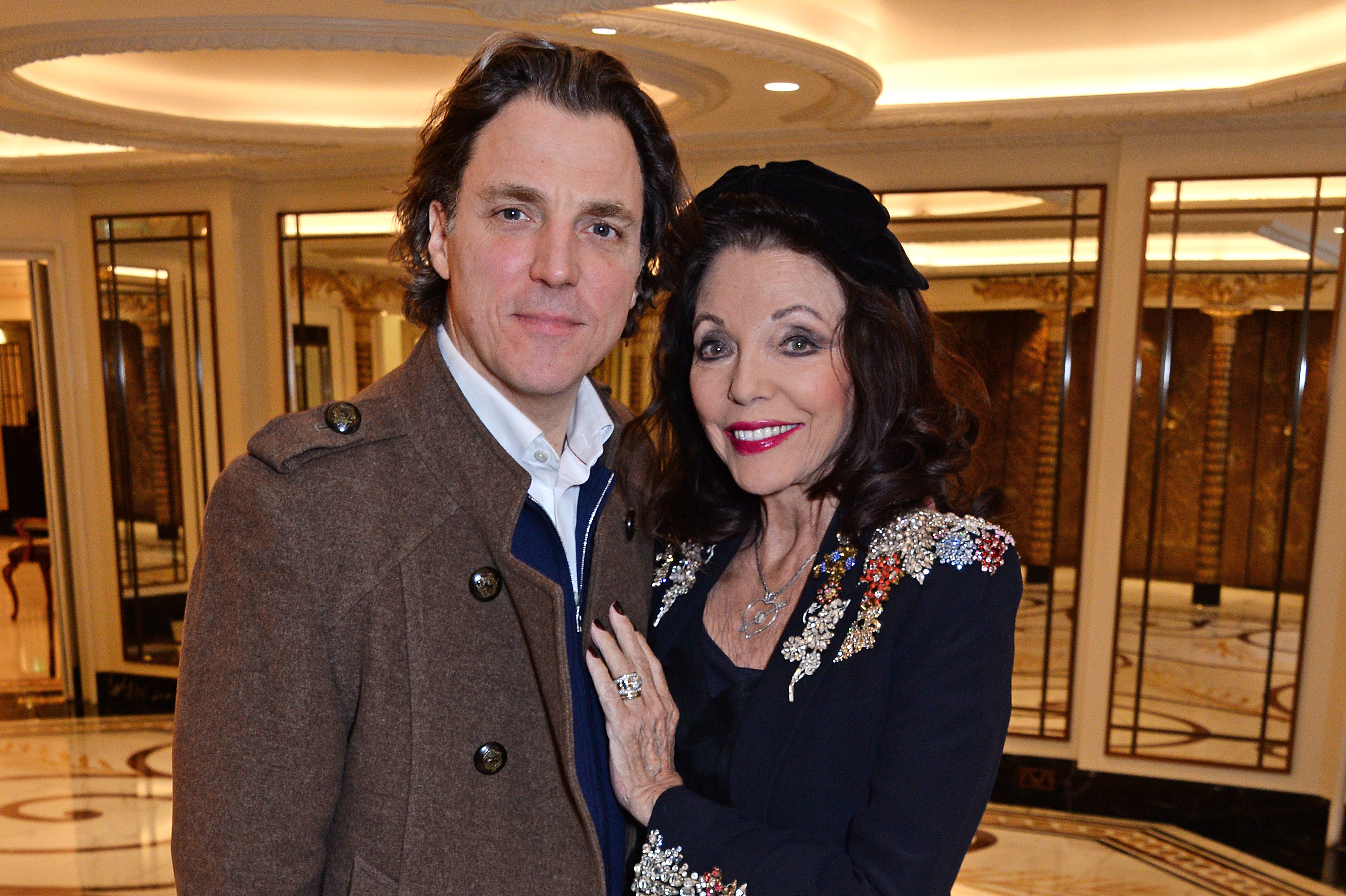Alexander Newley and Dame Joan Collins attend a festive afternoon at The Dorchester on December 19, 2018 in London, England. | Source: Getty Images