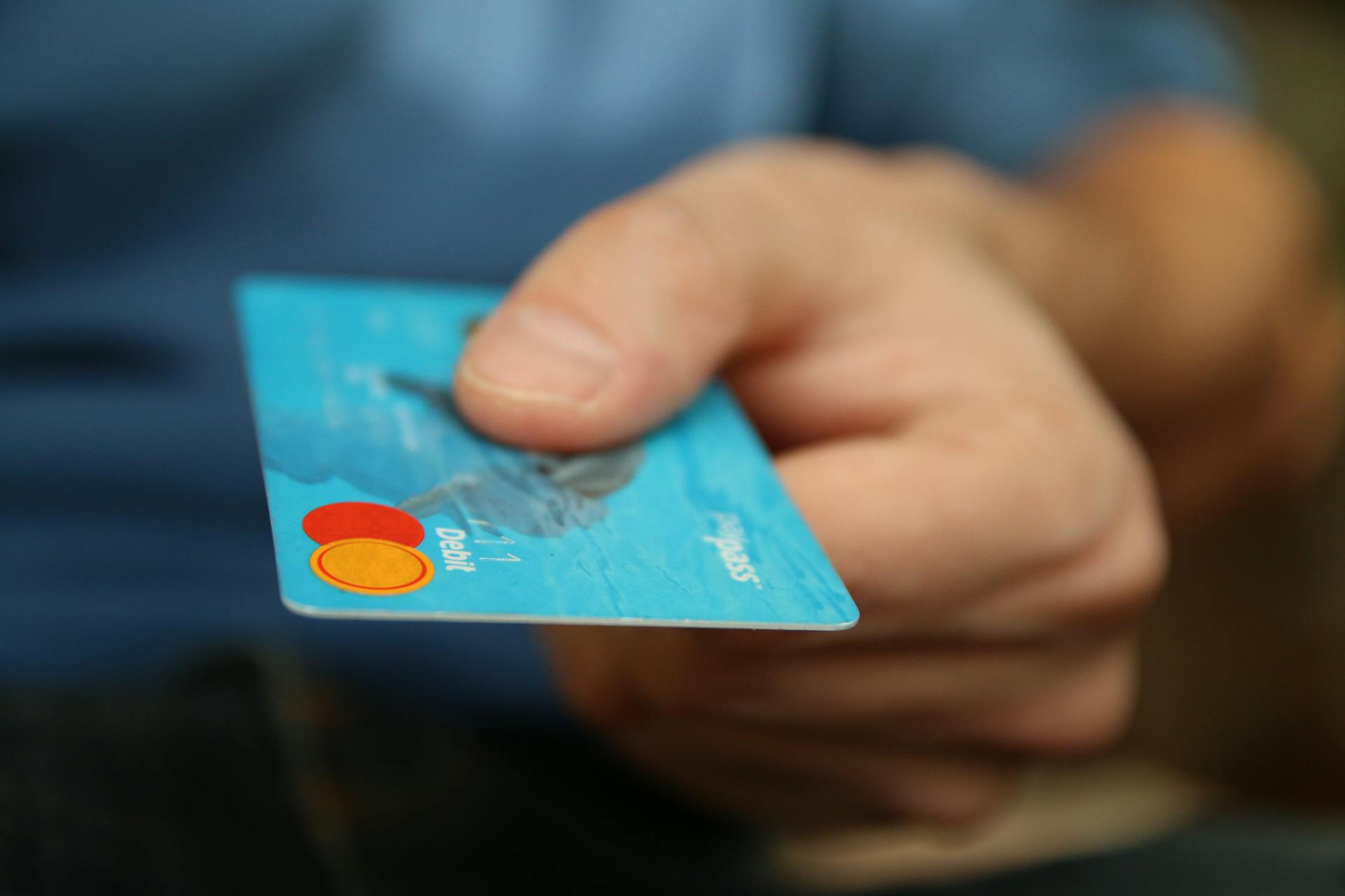 A person holding a debit card | Source: Pexels