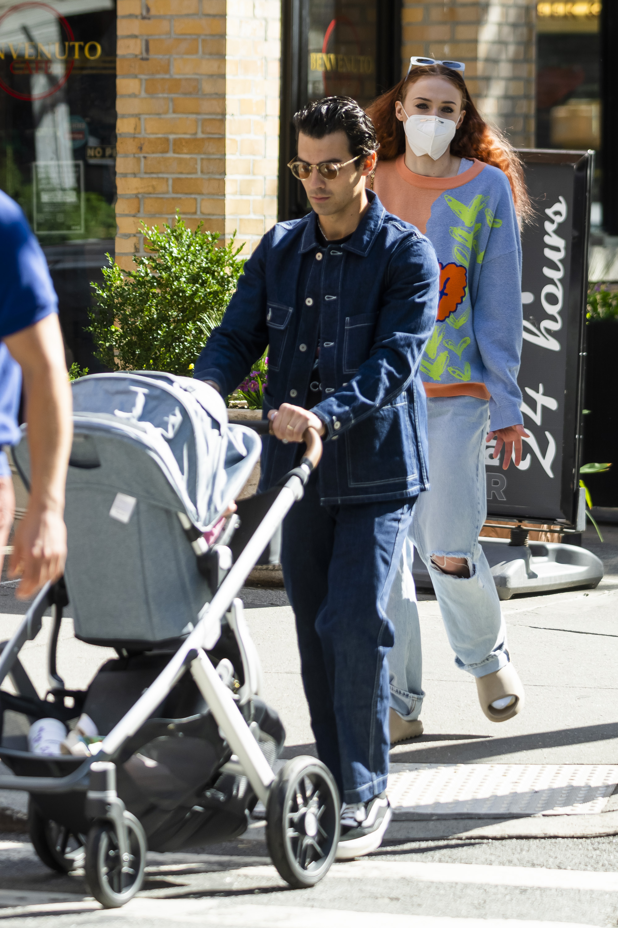 Joe Jonas pushes the baby stroller while Sophie Turner follows him in New York City on October 1, 2021 | Source: Getty Images