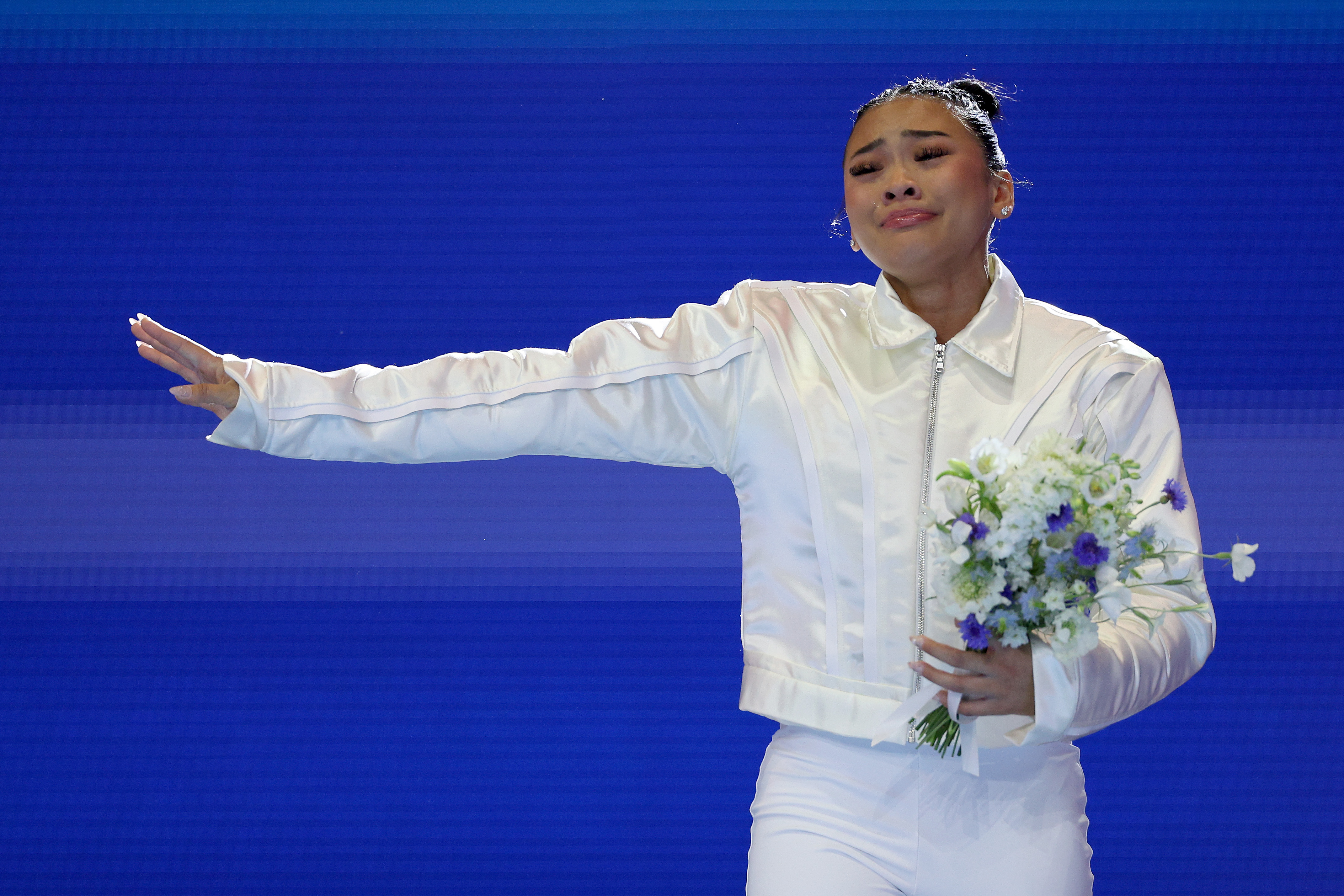 Suni Lee reacts after being selected for the 2024 US Olympic Women's Gymnastics Team at the 2024 US Olympic Team Gymnastics Trials on June 30, 2024, in Minneapolis, Minnesota | Source: Getty Images