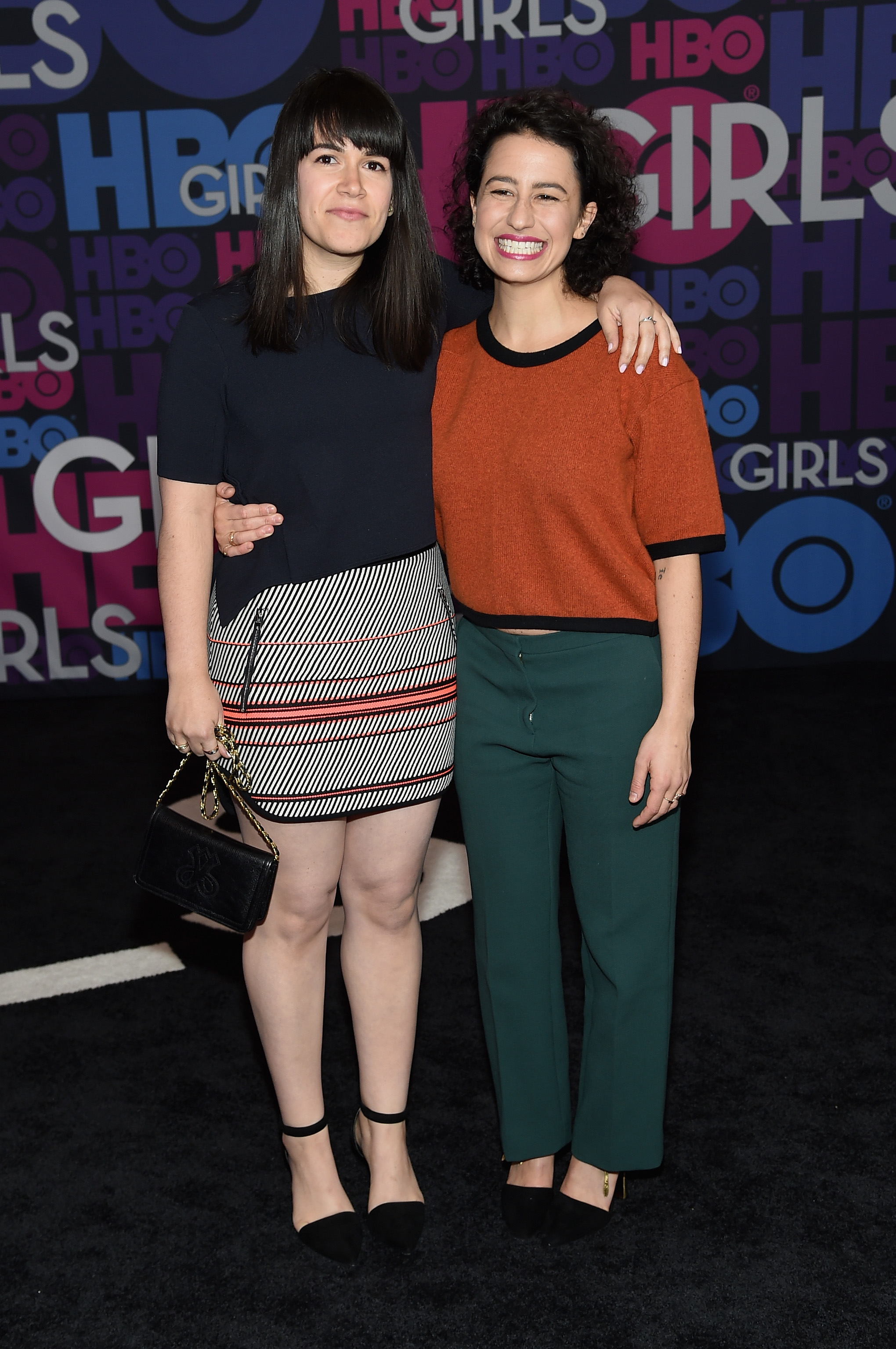 Actresses Abbi Jacobson and Ilana Glazer attend the "Girls" season four series premiere at American Museum of Natural History on January 5, 2015 in New York City | Source: Getty Images