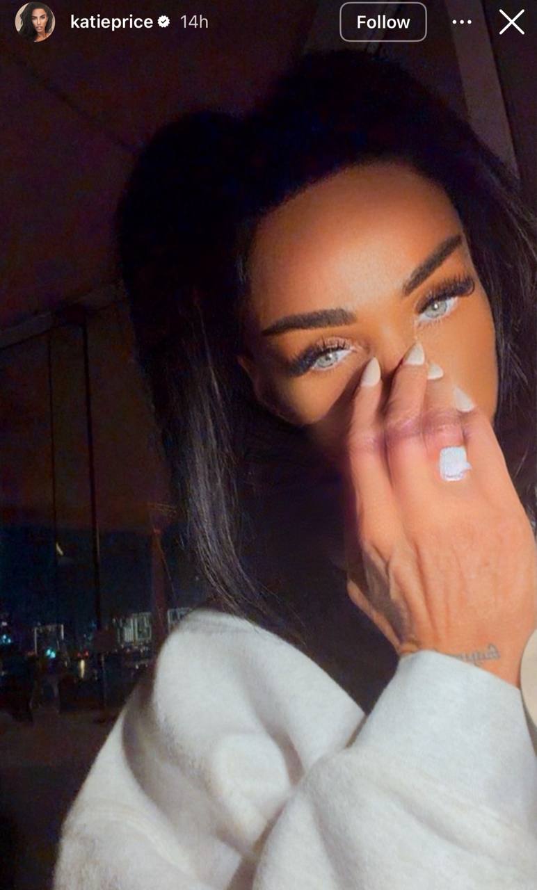 Wrapped in a fluffy white robe and glowing with her signature glam, Price gave fans a closer look at the massive rock now sitting proudly on her hand — with her piercing blue eyes locking in all the attention. | Source: Instagram/katieprice