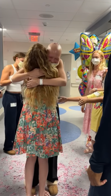 Jean Muggli hugs Isabella Strahan in celebration of Isabella completing her chemotherapy, June 2024. | Source: YouTube/IsabellaStrahan