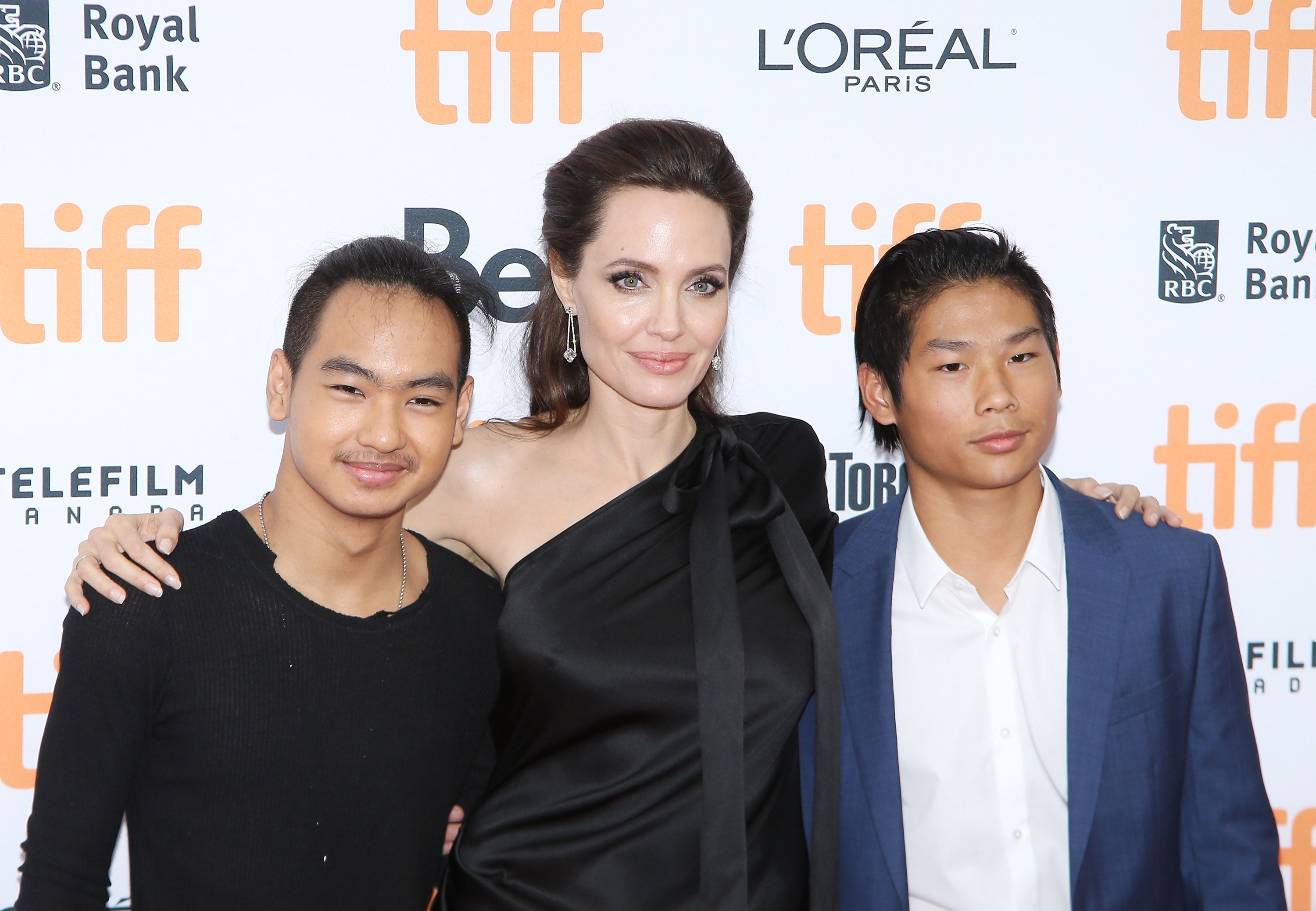 Angelina Jolie with her sons, Maddox Chivan Jolie-Pitt (L) and Pax Thien Jolie-Pitt arrive to "First They Killed My Father: A Daughter of Cambodia Remembers" premiere on September 11, 2017 in Toronto, Canada. | Source: Getty Images